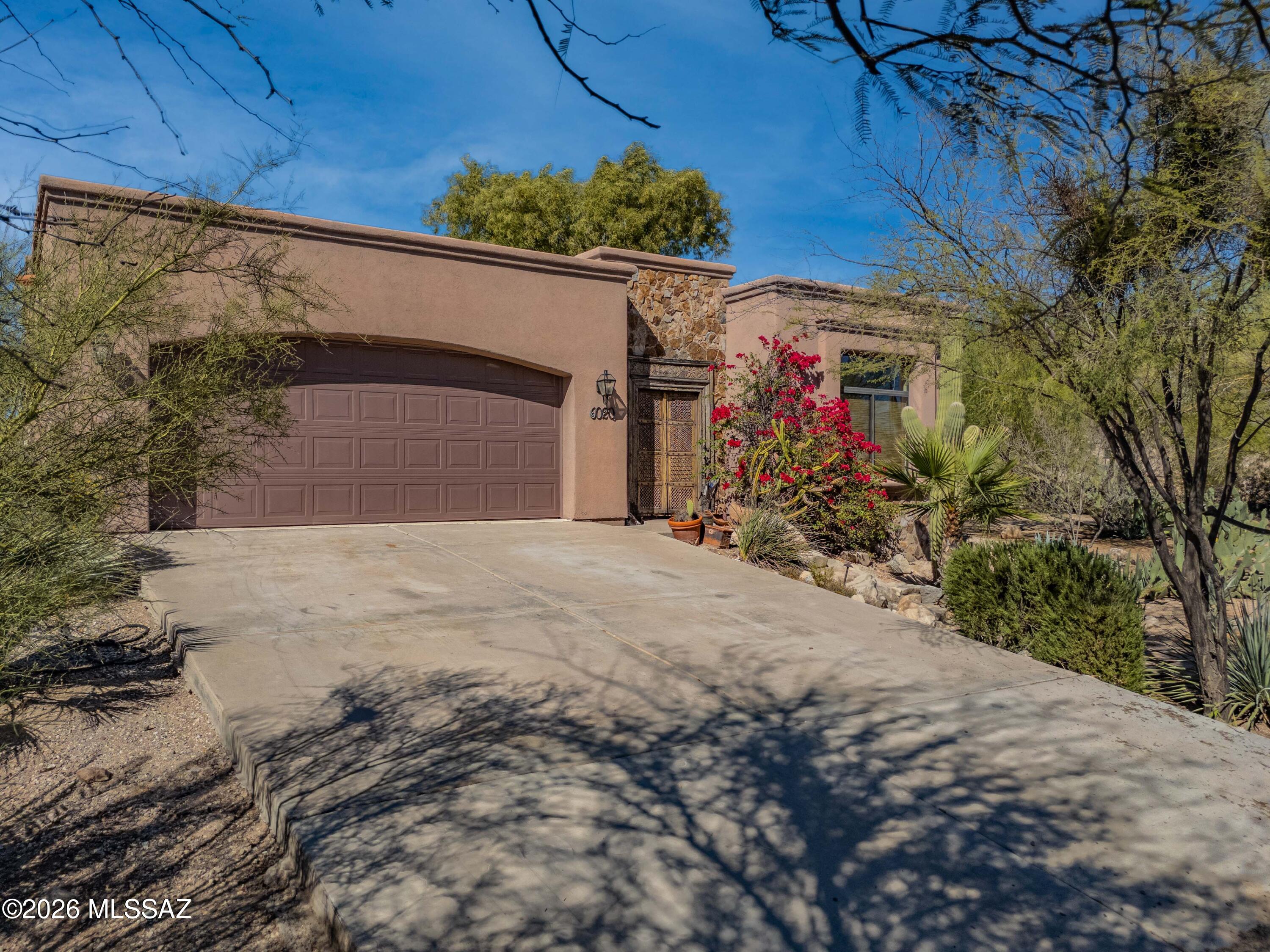 Welcome to this stunning private desert escape situated on an acre of land, close to all of the amenities of the city. This custom built property offers a beautifully landscaped front yard, lush courtyard, and large deck to enjoy cool desert nights. Inside, the home features an open concept with lots of light. Step through the warm entryway to the great room, which offers plenty of room to relax and entertain. The chef's kitchen features granite counter tops, a large island and wine fridge. The primary suite offers a custom closet and luxurious bathroom with both a tub and tiled shower. Other highlights include a large laundry room, ample garage and newer HVAC unit.