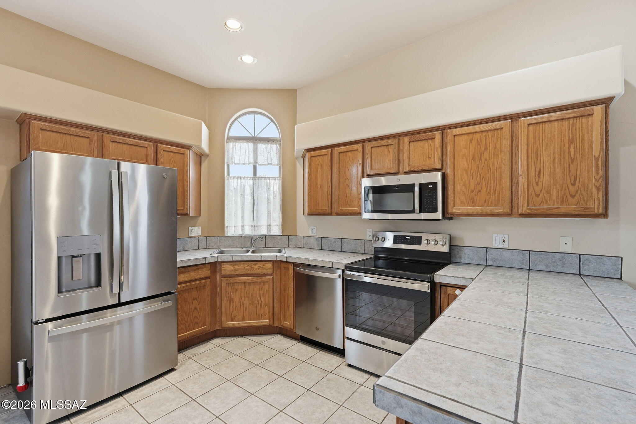 This 2BR/2BA patio home features one of the largest floor plans in the subdivision (1,132 sq. ft.). Key features include Security & Efficiency: Electric security shutters, security doors for airflow, dual-pane windows, and extra insulation. Recent Upgrades: AC replaced in 2019, water heater in 2021, and roof repairs  2025. This gated adult community is near Foothills Mall, the YMCA, and various restaurants. HOA Coverage: water, trash, roof maintenance, exterior building maintenance, and common areas. While the home requires a few cosmetic upgrades, it has been priced competitively for a quick sale. Please let me know if you would like to schedule a viewing.