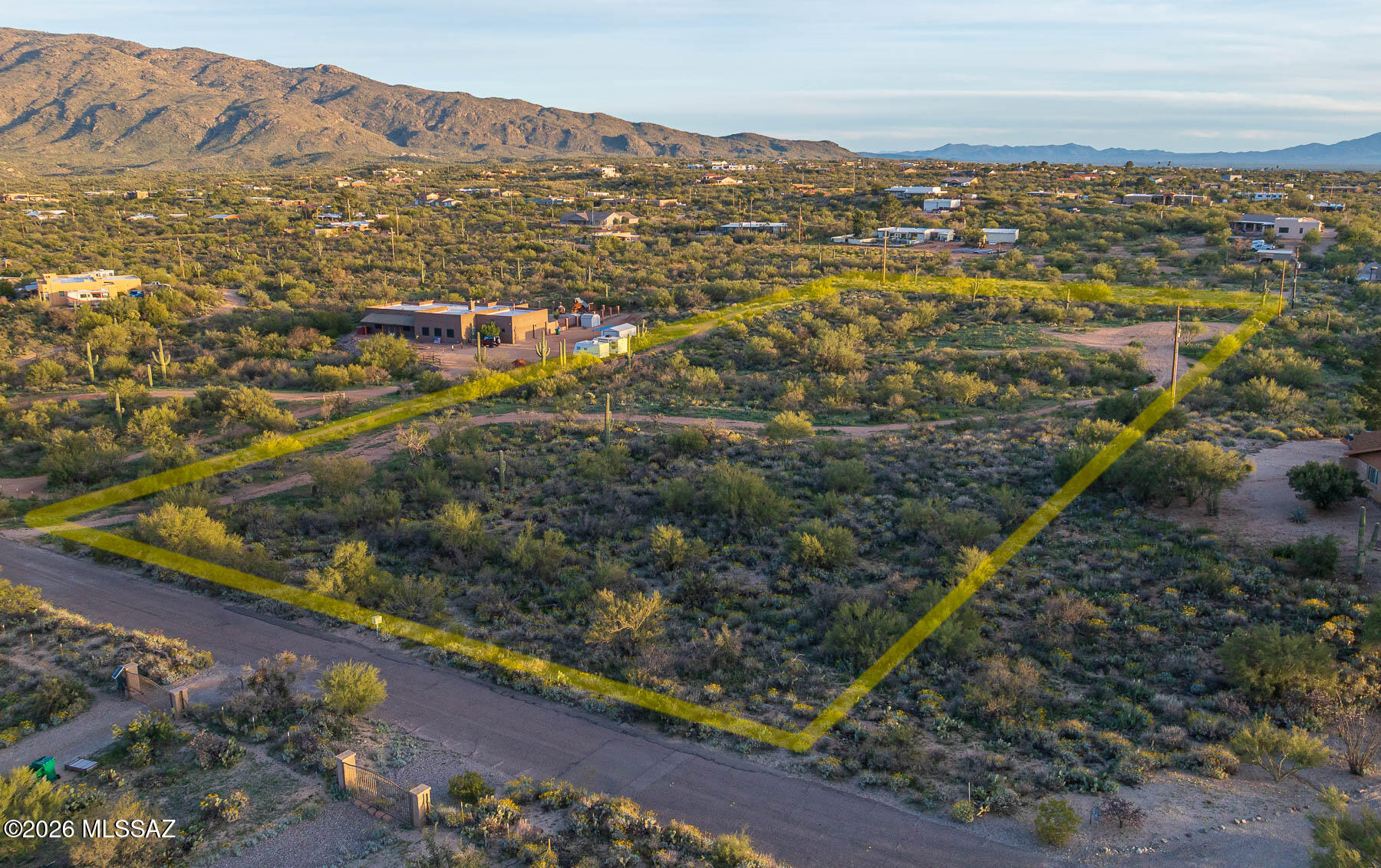 Gentle slope offering spectacular mountain views of both the Rincon Mountains and the Santa Catalina Mountains. The property features mature vegetation, including several beautiful saguaros, with a dirt driveway and building pad already in place. Paved road access leads directly to the lot, making it an easy and convenient build. Located in the highly regarded Tanque Verde Unified School District, known for its excellent schools. Just minutes from Saguaro National Park. A fantastic opportunity in a highly desirable area!