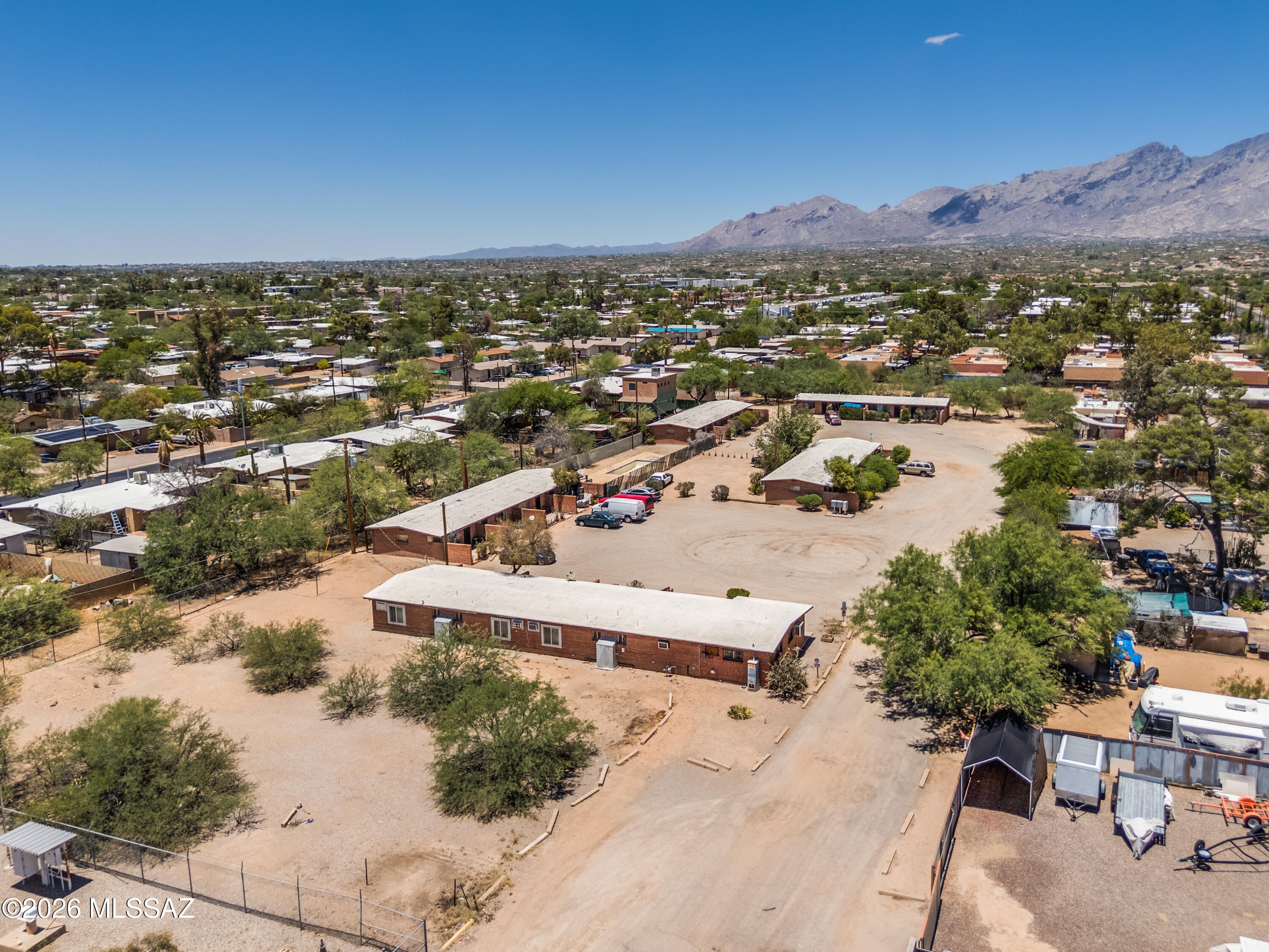 Rare Opportunity Zone investment offering immediate cash flow with exceptional long-term redevelopment potential. Situated on approximately 2 acres, the property consists of 20 units across five buildings with the ability to develop an additional 10 units. A distinctive exit strategy allows the asset to be positioned as either a 30-unit multifamily community or subdivided into eight separately saleable parcels comprised of seven fourplexes and one duplex. Existing improvements include an on-site swimming pool, laundry facility, and office/storage space. Future enhancements may include new asphalt, sidewalks, parking, landscaping, and site improvements to further maximize value and marketability.
