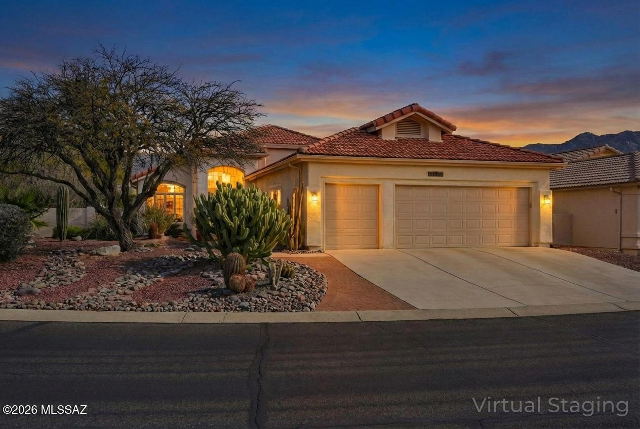 Seller Highly Motivated! Turnkey Ventana model with 1,878 sq ft, 2 bedrooms, 2 baths on a desirable corner lot with mountain views. Recently added Arizona Room enhances living space and natural light. Updated kitchen features granite countertops, breakfast bar, and breakfast nook. Tile and LVP flooring throughout, soaring ceilings, skylights, and plantation shutters add style and brightness. Guest room includes a Murphy bed. Primary suite offers patio access with remote screens. Spacious 2.5-car garage with golf cart space and cedar closet. Citrus trees include grapefruit and pomegranate. Roof underlayment replaced in 2024, HVAC 2019, Kinetica water softener system, and updated irrigation system.