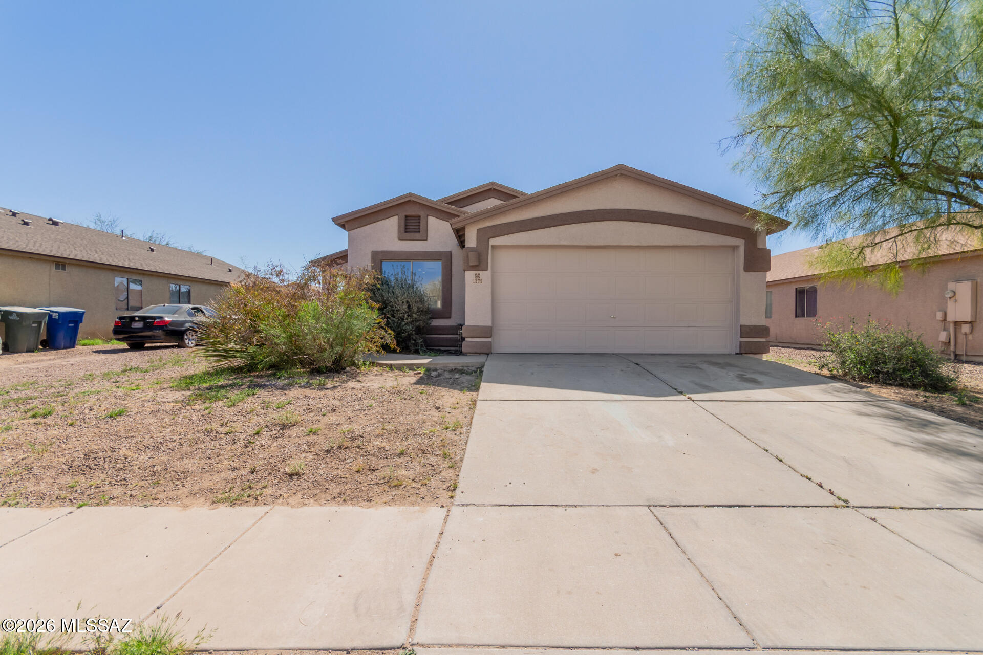 Discover this charming single-story 3-bedroom, 2-bath home offering a comfortable living space in a great Tucson location close to restaurants, shopping and convenient access to I-19. Inside, you're welcomed by a spacious living room with vaulted ceilings, soft carpeting underfoot, abundant natural light and a soothing color palette that creates a warm and inviting atmosphere. The well-appointed kitchen features ample counter space, built-in appliances and plentiful cabinetry, making meal preparation easy and enjoyable. The primary suite provides a comfortable retreat with a private bathroom and closet space. This home is move in ready with brand new interior and exterior paint, new blinds and new carpet. A brand new roof installed in March 2026 offers added value and peace of mind for years to come. Step outside to the spacious backyard, offering plenty of room for entertaining, relaxing, gardening or creating your ideal outdoor living space. With its functional layout, recent updates and convenient location, this home presents a wonderful opportunity for buyers seeking comfort, value and everyday convenience in Tucson.