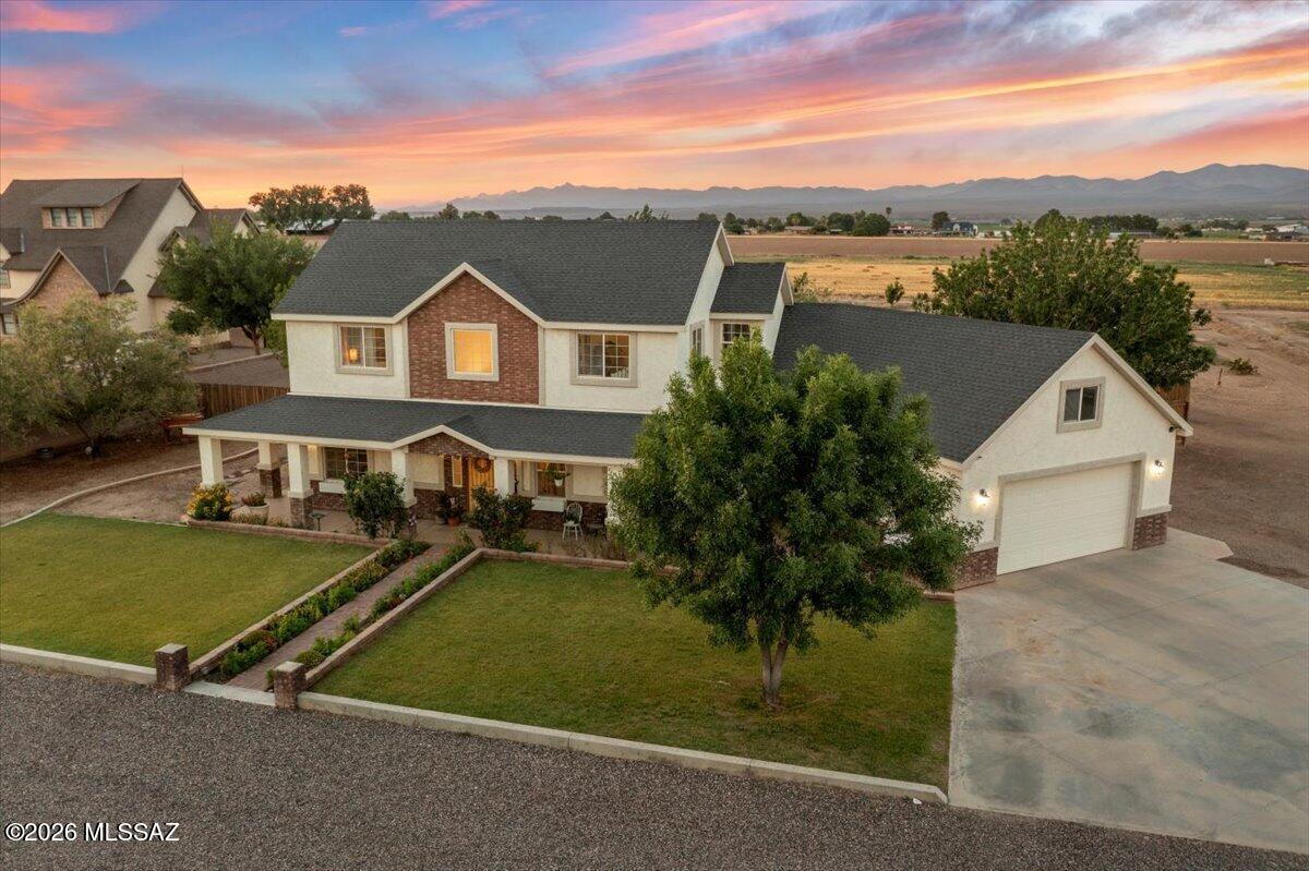 ***Custom Home on 1.67 Acres with Horse Privileges, Bonus Room & Outdoor Living*** Well-maintained custom home situated on 1.67 landscaped acres in Thatcher/Central Arizona. This 4-bedroom, 3-bath property offers quality construction, functional living spaces, and room to enjoy both indoor and outdoor activities. The open-concept floor plan features granite countertops throughout, custom cabinetry, upgraded appliances, a spacious pantry, custom closet systems, and an oversized laundry room. The primary suite includes travertine tile showers, dual vanities, and ample storage. Above the garage, an unfinished bonus room of approximately 350 square feet provides the opportunity for a home office, game room, fitness area, guest space, or additional storage. Outdoor features include covered patios, a fire pit, irrigated lawn, and a sidewalk walking path
that circles the backyard. The fully fenced yard offers privacy and space for entertaining, pets, and recreation. A separate garden area and horse privileges add flexibility for those seeking a
rural lifestyle with room to grow. Located on the border of Thatcher-Central, this property combines the benefits of country living with easy access to schools and town.