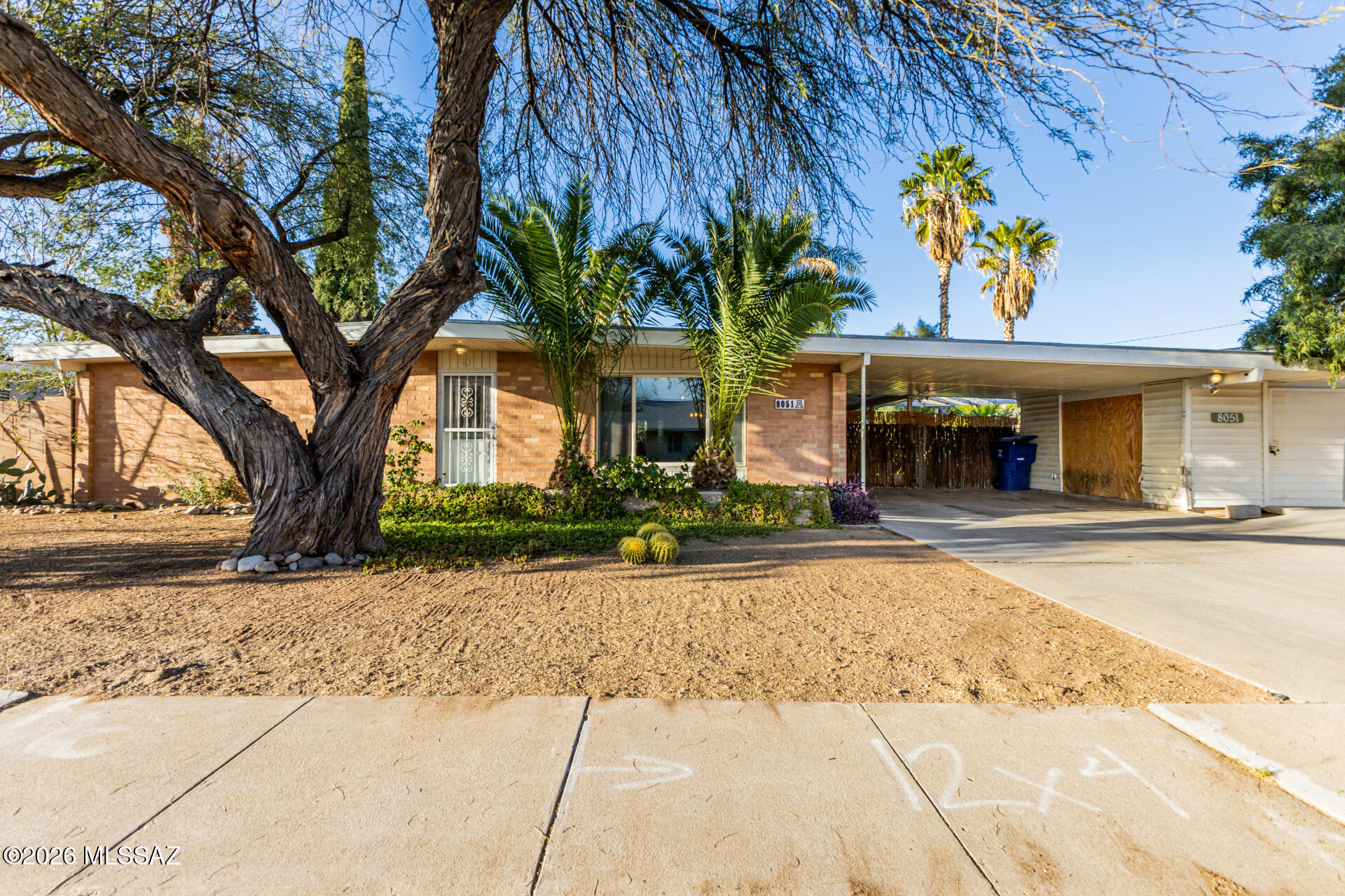 Welcome to this 3 bedroom, 2 bath corner-lot home capturing the best of Arizona living with inviting indoor spaces and a backyard designed to enjoy year-round. Inside, you'll find tile flooring throughout and an updated kitchen featuring granite countertops, rich wood cabinetry, tile backsplash, and a center island perfect for gathering. The spacious primary suite includes mirrored double closets and a private ensuite bath. Step outside to a backyard built for relaxing and entertaining, complete with a sparkling pool, real Arizona-grown grass, covered patios, mountain views, and mature citrus trees. A detached shed provides additional space for hobbies, storage, or a game-day retreat.