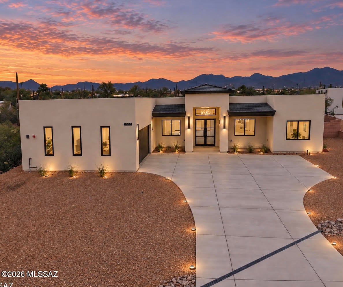 Welcome to refined desert living in this beautifully new-construction home situated on a spacious one-acre lot. Designed with timeless, designer-inspired finishes throughout, this 3-bedroom, 3-bathroom home with a dedicated office offers a perfect blend of style, comfort, and functionality.
From the moment you enter, the impressive foyer sets the tone with a welcoming sense of scale and sophisticated detail. The heart of the home is the custom kitchen, featuring rich alder wood cabinetry, a stunning quartzite island, and carefully selected finishes designed to create a warm yet elevated aesthetic. The open-concept layout provides an effortless flow between the kitchen, dining, and living spaces, making the home ideal for both everyday living and entertaining. Set on a full acre, the property offers the space and privacy that are increasingly hard to find, with endless possibilities for outdoor living, entertaining, or creating your own private retreat. A beautiful combination of custom details, modern functionality, and timeless design makes this home truly special.