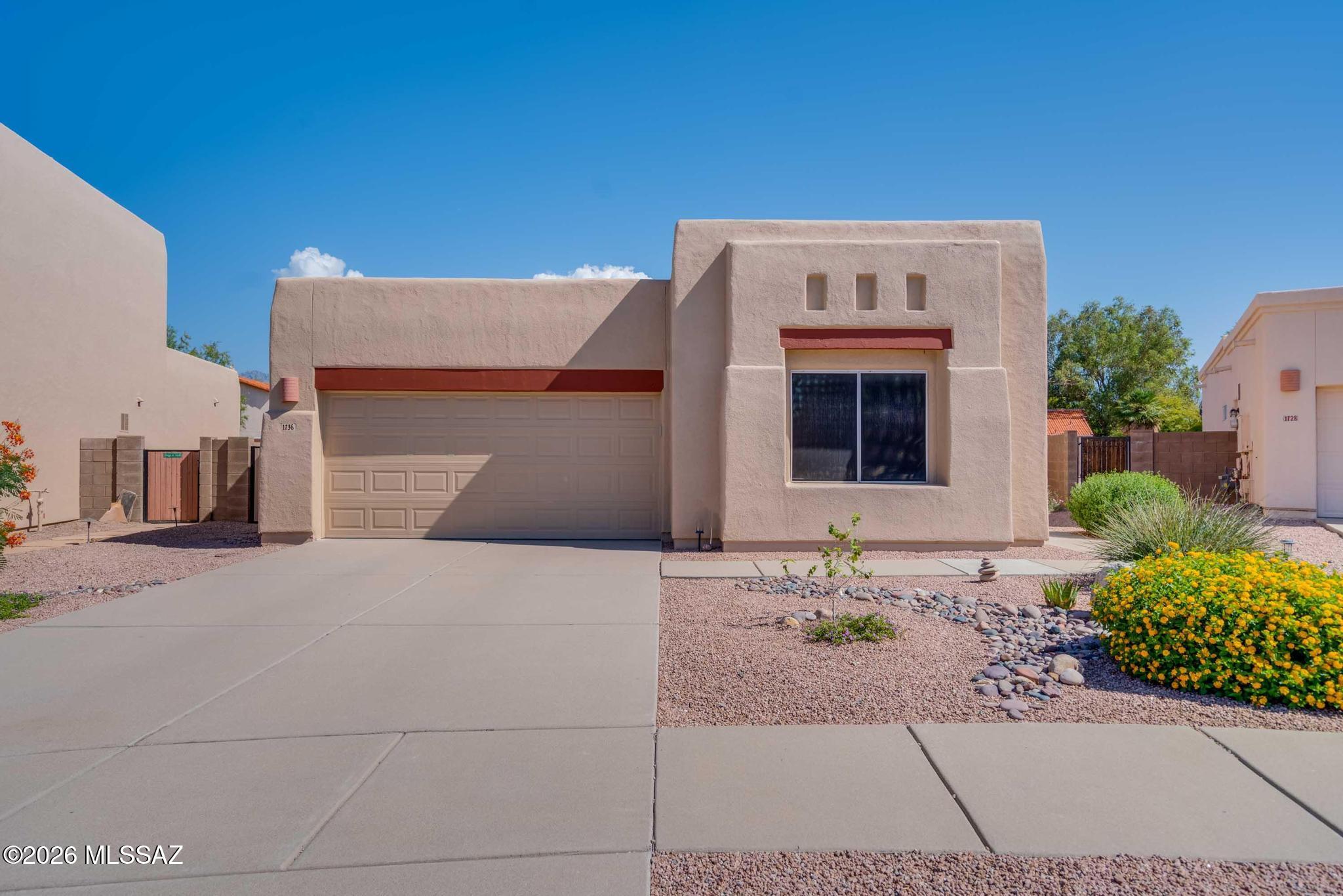 Welcome to 1736 N Wild Hyacinth Dr, tucked away in a quiet cul-de-sac in highly desirable NE Tucson. Known for its scenic mountain views, established neighborhoods, and close proximity to outdoor recreation, this location offers the perfect balance of convenience and lifestyle. This 3 bed, 2 bath home features 1,433 sq ft with vaulted ceilings and a functional split floorplan. Plantatation shutters gives an elegant touch. The kitchen includes granite countertops, updated cabinetry, and modern finishes, while tile flooring throughout provides low-maintenance living. The backyard is designed with turf and paver accents, creating a clean, usable space for relaxing or entertaining. Complete with a 2-car garage and easy access to shopping, dining, parks, and top-rated schools.