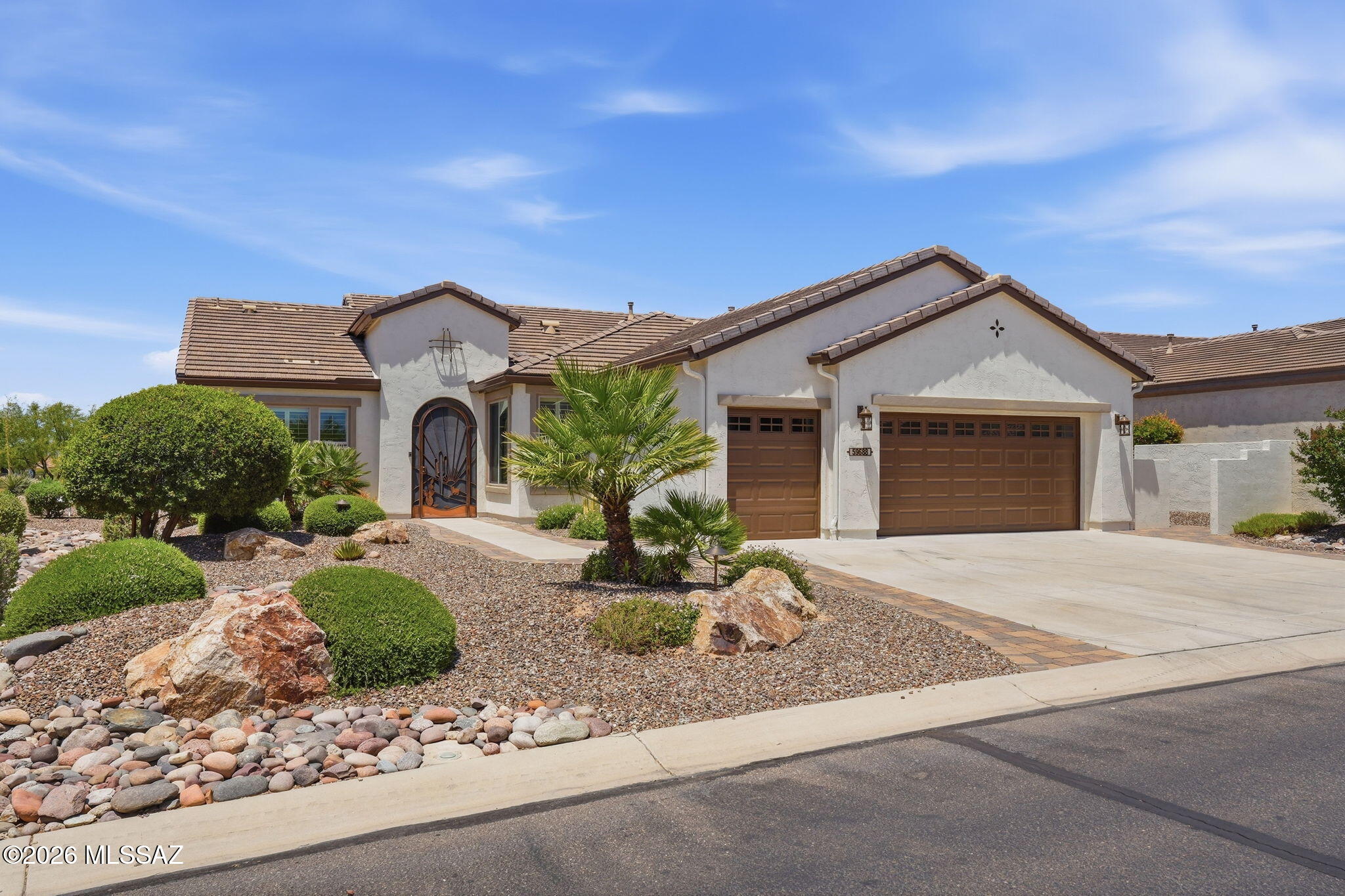 This premium SaddleBrooke Ranch (Unit 4A) home offers the ultimate Arizona resort lifestyle. The versatile layout features 2 bedrooms, 2.5 baths, and a private den/office perfectly positioned just off the entryway.  The gourmet kitchen features custom cabinetry, premium granite countertops, high-end KitchenAid appliances, and a seamless flow into the adjacent dining room.   The bright, open-concept living area brings everyone together, making it perfect for hosting guests or relaxing in style.  Walk out through the sliding glass doors to a large, covered back patio featuring a built-in grill. Enjoy picturesque views of the manicured golf course right from your backyard.   The 2.5-car garage provides plenty of space for your vehicles, golf carts, and extra storage needs.