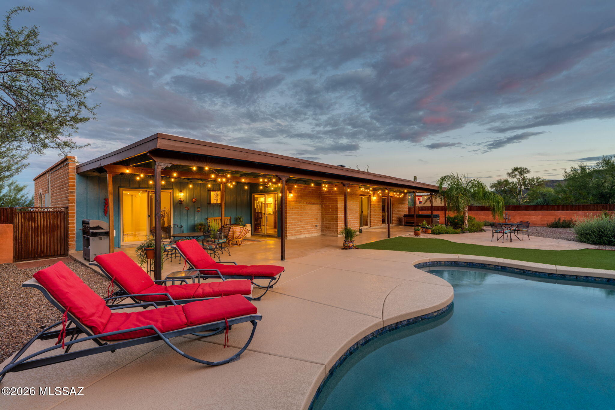 Beautifully updated 1973 burnt adobe Southwestern-style home situated on nearly an acre (.967) in Casas Colinas, offering sweeping mountain and city views, dark skies, and a wonderful sense of privacy. Thoughtfully renovated over the years, this distinctive home blends timeless Tucson character with modern comfort. The open, completely remodeled kitchen is complemented by updated bathrooms, Saltillo tile, newer carpeting in the bedrooms, new windows throughout--including sliding doors--fresh interior paint, updated fixtures, ceiling fans, and strategically placed solar tubes that bring natural light where it matters most. Outdoor living is equally inviting, featuring a newer Pebble Tec saltwater pool, low-maintenance artificial turf, mature palms and established landscaping, along with a reconfigured enclosed yard framed by block and corrugated-metal fencing. The two-car garage was substantially rebuilt in 2024 using burnt adobe brick to complement the architectural character of the home. Additional improvements include refreshed burnt adobe exterior finishes, roof-edge repairs, and a 10' x 12' storage shed.

With generous land, no HOA, and space that may accommodate an RV and/or future casita (subject to applicable zoning and approvals), this property offers a rare opportunity to enjoy privacy, views, and authentic Southwestern charm while remaining conveniently connected to Tucson.

Ideally located with easy access to Interstate 10, the University of Arizona, Banner-University Medical Center, downtown Tucson, the Arizona-Sonora Desert Museum, and major employers including Raytheon, Caterpillar, and Freeport-McMoRan. Restaurants, retail, and everyday conveniences are also within easy reach.