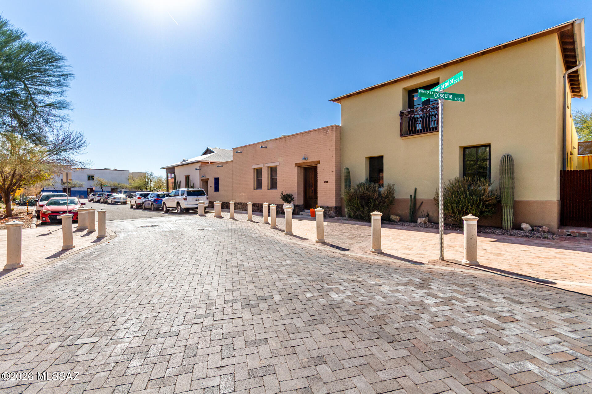 Artisan Builders custom, masonry built - Mercado District 3 Bedrm/3 bth + Loft, 2 car garage. Walk thru front gate to a large outdoor patio w/ an inviting courtyard & artistic landscape.  Interior includes:Great rm w/ high ceilings, recessed lighting, a soothing palette, natural light, & durable tile flooring. The stunning kitchen comes w/ granite counters, flat-panel cabinetry for a modern aesthetic, a tile backsplash, stainless steel appliances, and a peninsula with a breakfast bar. The luxurious primary bedroom showcases soft carpeting, a lavish ensuite with dual sinks, & a walk-in closet. Unwind on the charming rooftop deck, offering majestic mountain views, ramadas, & a relaxing jacuuzi. Walk to Street Car & coffee. Primary bedroom is on the 2nd floor.  2 other bedrooms are on the 1st floor.  Great room has extra large windows overlooking the patio attracting natural, soft light into the 1st floor.  This home feels elegant and relaxing.  Includes a metal roof, new water softner, laundry shoot, custom windows.    
Gate next to triangle house is this property's land for a stairwell for a guest house above the garage. 
Walk to the Mercado or the Annex for a coffee, pastry or eat at one of many favorite local eateries.  Shop at you favorite local clothing store.  Easy access to 100 mile bike loop and easy walk up A-Mountain or Tumamoc Hill.  Take the Street Car to the University of Arizona, Downtown Library, or Banner Medical Center. 
Seller will review all offers by 2-16 @ 5pm & respond by 2-17 @5pm.
