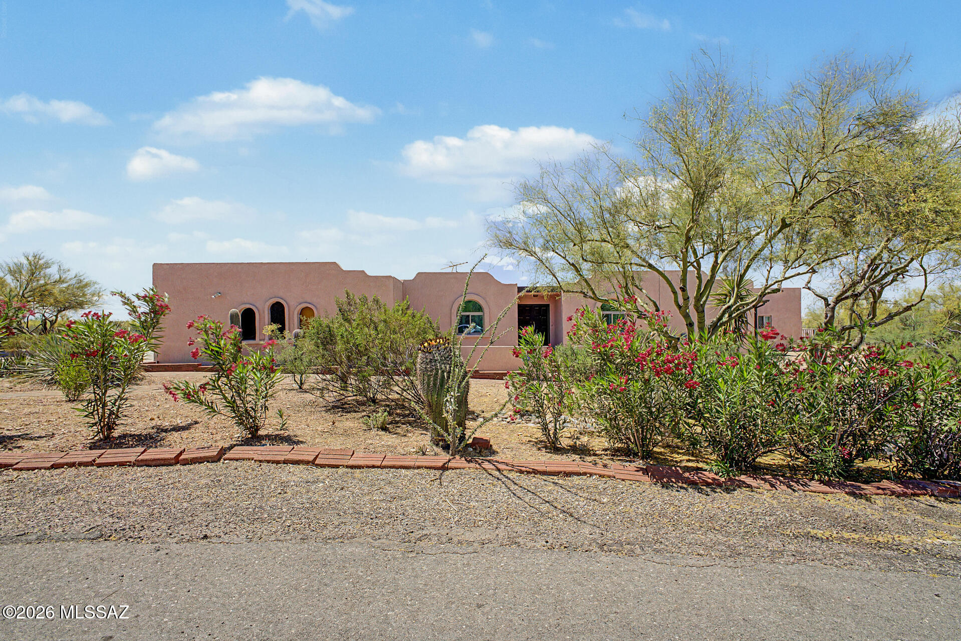 Set on an expansive 1.71-acre corner lot, unique property features two fully separate 3-bdroom, 2-bath homes, ideal for multi-generational living. HomeA 1978yr  HomeB 2025yr build
The primary (original) residence offers a circular driveway, 2-car garage, and courtyard entry. Inside, you'll find a split floor plan with great natural light, a sunken living room, formal dining area, and a cozy family room with a beehive fireplace. The kitchen includes stainless steel appliances, a breakfast bar, and ample cabinetry. The primary suite features a sitting area, walk-in closet, and dual-sink vanity. This home provides a solid foundation and excellent opportunity for upgrades or personalization.
The second home is a brand-new build, thoughtfully designed with modern finishes and valued at over $ The Arizona room, enhanced with ceiling fans, is perfect for relaxing & enjoying the surroundings year-round. An attached guest house offers excellent flexibility with its own open layout, stylish open kitchen fully equipped, & a main suite w/barn-style sliding door leading to a modern bathroom w/a dual sink vanity & LED lighting mirror. The backyard is a private oasis comprising a sparkling blue pool, covered patio, raised garden beds, gorgeous trees, & breathtaking mountain vistas. Truly exceptional desert retreat! Hurry!