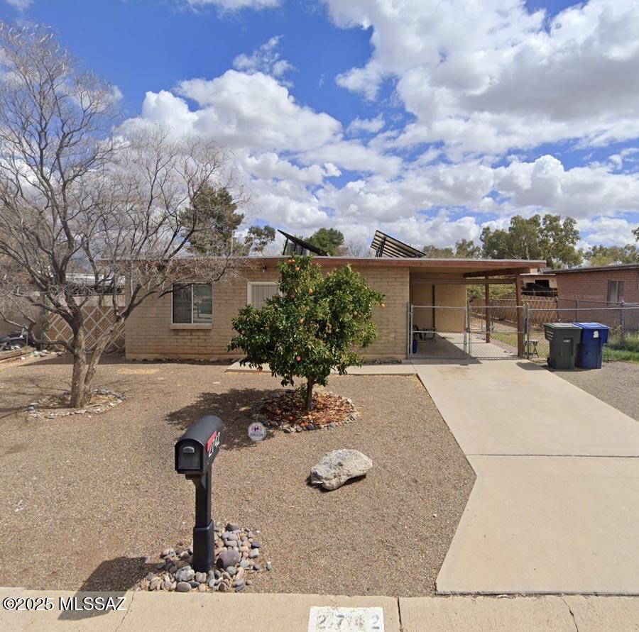 Cute midtown rare 3-bedroom bungalow has been well maintained, has dual pane windows which, along with its masonry construction, makes the interior of this home whisper quiet. Home has been upgraded with solar panels (owned) plus a City of Tucson-approved irrigation system for front- and backyards (but never used!). Ceramic tile throughout. Freshly painted interior and exterior. Skylight and solatubes for increased ambient lighting. Utility shed cum laundry off carport. Spacious backyard with plenty of room for a pool, an ADU, or even a pickleball court! Mature citrus in front yard. Dog run on north side. All electrical lines have been buried out of sight! Nearby shopping, restaurants, and neighborhood amenities. Friendly neighbors and neighborhood. Welcome home!