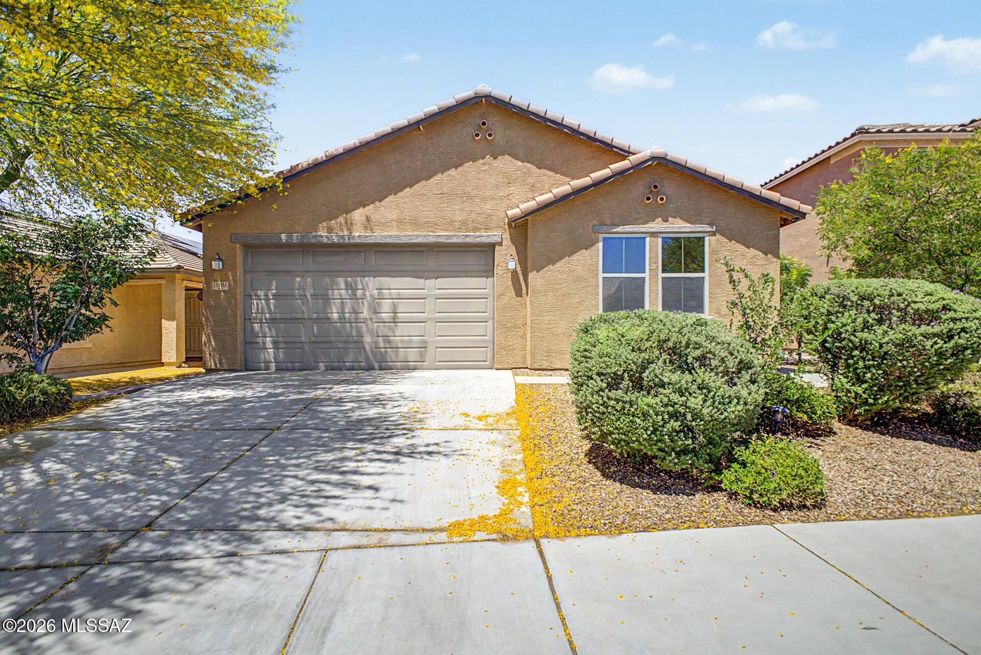 Located in the desirable Gladden Farms community, this well-maintained home offers 3 bedrooms, 2 bathrooms, a den, and a 2-car garage. The open-concept floor plan is filled with natural light and features neutral finishes, recessed lighting, tile flooring throughout the main living areas, and carpet in the bedrooms. The kitchen includes granite countertops, tile backsplash, stainless steel appliances with gas cooktop, pantry, ample cabinetry with crown molding, and a large island with breakfast bar. The spacious den provides flexibility for a home office, playroom, or additional living space. The primary suite features dual sinks, walk-in closet, and private bath. Enjoy the backyard with a covered paver patio, artificial turf, and no rear neighbors.
