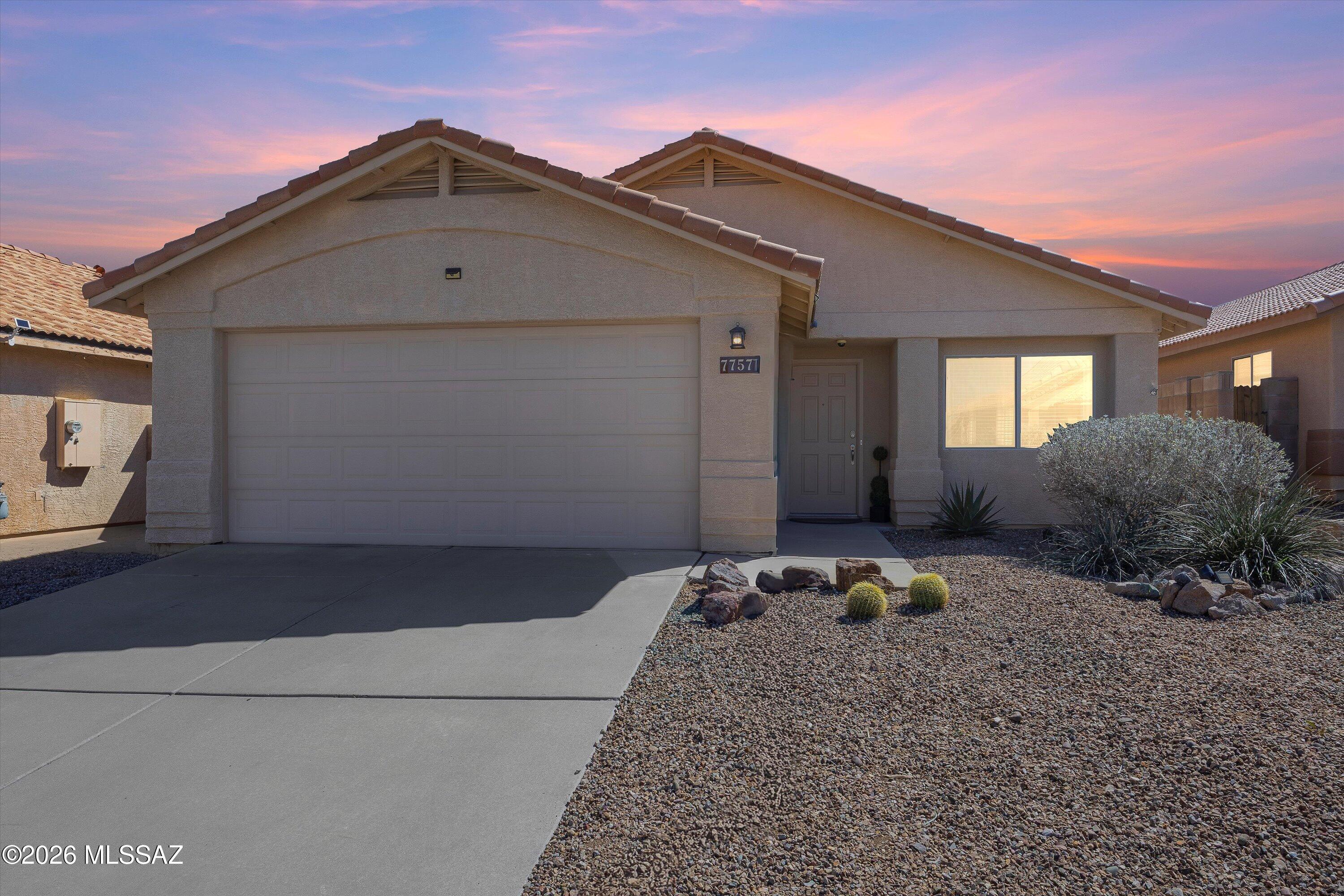 This well-maintained 4-bedroom, 2-bath home in the heart of Rita Ranch offers space, flexibility, and thoughtful updates  all within the highly sought-after Vail School District & with no HOA! **NEW ROOF in 2025!** A spacious front living room/dining room welcomes you at entry and provides flexible space for a home office, playroom, workout area, or additional living space, while a separate family room at the back of the home creates a comfortable setting for everyday living and gathering. The kitchen features granite countertops, a pantry & ample cabinetry with an open feel to the main living area. The classic granite continues in both bathrooms for a cohesive, updated look. Tile flooring runs through the primary living spaces, with luxury vinyl plank flooring in all bedrooms for a clean, modern, carpet-free finish. The primary bedroom includes a walk in closet & high ceilings and the ensuite has a double vanity & a garden tub/shower combination. The low-maintenance backyard offers park-like turf and a covered patio ideal for relaxing or entertaining. Fresh interior paint, a full appliance package, and evident pride of ownership make this home truly move-in ready, conveniently located near parks, shopping, and everyday amenities in one of Tucson's most popular southeast communities. Come see and make it your home.