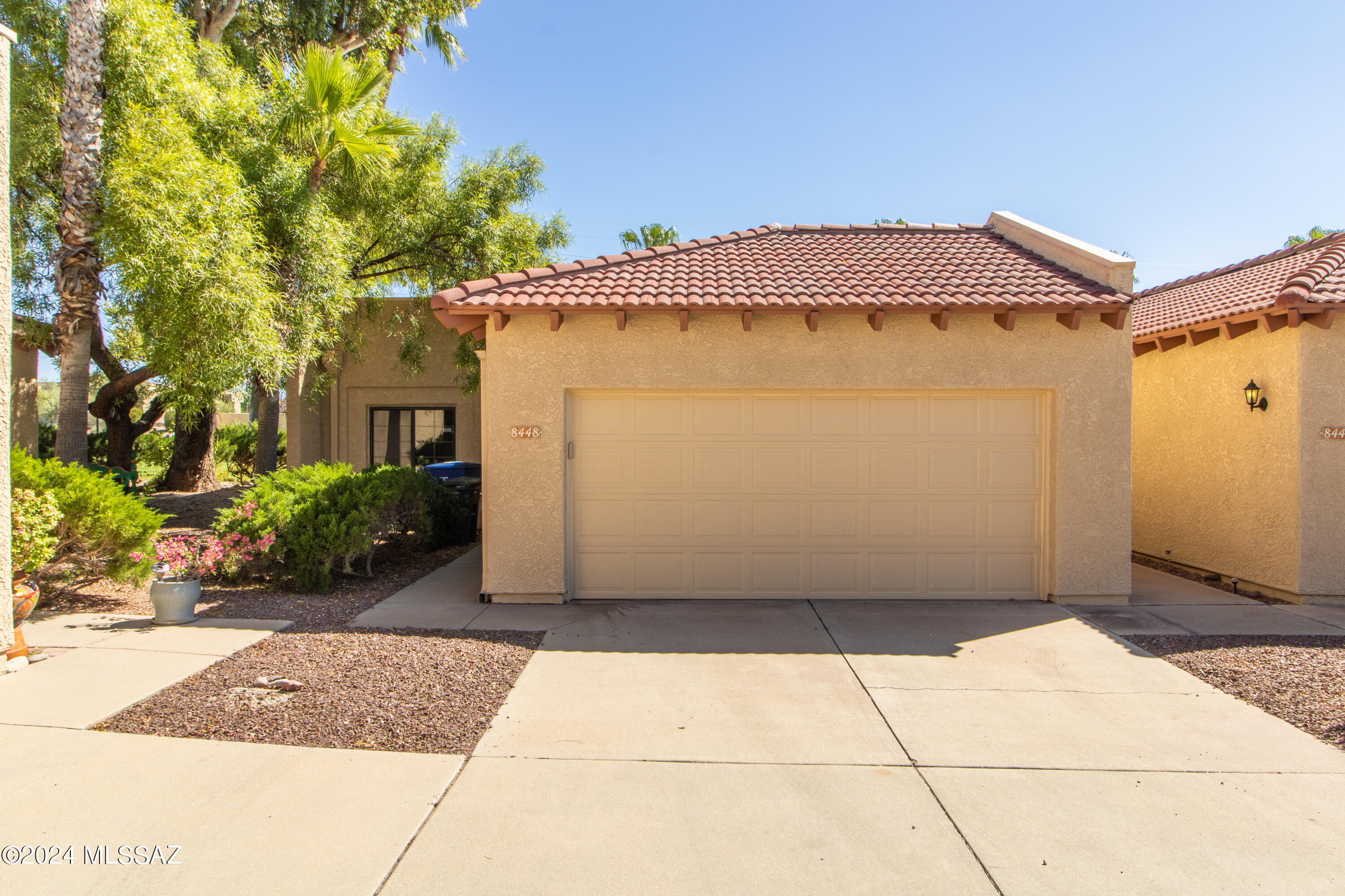Beautiful end unit townhome with 2 car garage move in ready. Features newer stainless steel appliances, updated Kitchen, newly painted interior and carpets, new water heater, finished brick fireplace, upgraded lighting and ceiling fans throughout home, and much more. 2 car garage with sealed flooring, work bench, custom cabinets, and extra ceiling fans and lighting. Landscaped rear yard with pavers and river rocks along back garden. Newer roof with reflective white coating for energy efficiency. A MUST
SEE!