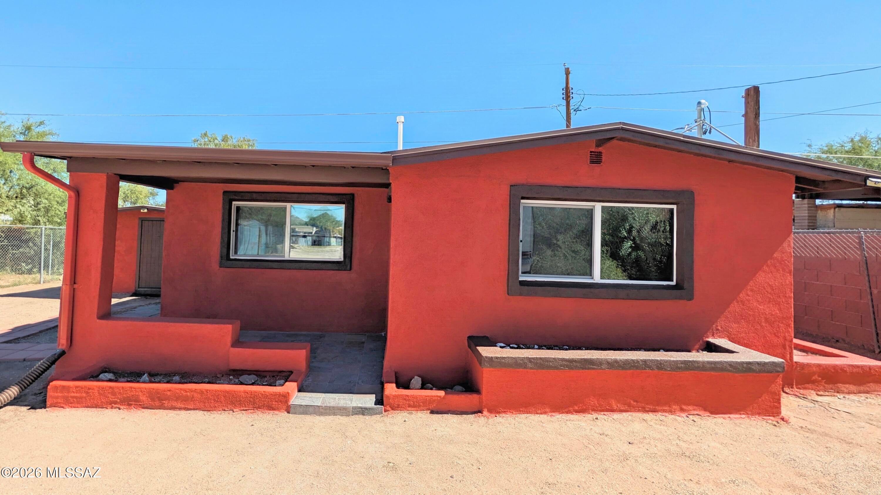 Beautifully remodeled in 2023, this property offers a 2-bed, 1-bath main home, plus a separate studio casita--perfect for guests or extended family. 
Culinary enthusiasts will love the upgraded raw stone marble countertops, striking waterfall edge, and matching marble backsplash, perfectly paired with stainless steel appliances.
The luxury extends into the spa-like bathroom, beautifully finished with matching marble counters, stunning labradorite tile throughout the shower, a soothing 6-body-jet system with a rainfall showerhead, a dual-flow toilet, and an LED backlit smart mirror.
Every detail has been addressed for comfort and peace of mind, including fresh interior and exterior paint, efficient mini-split systems for heating and cooling, and a high end water filtration system. Situated on a fully fenced and gated lot, the property offers fantastic RV parking and breathtaking sunset views. Enjoy the freedom of no HOA, while staying just minutes away from local schools and shopping centers. Priced to sell and brimming with endless potential--don't miss this rare find!