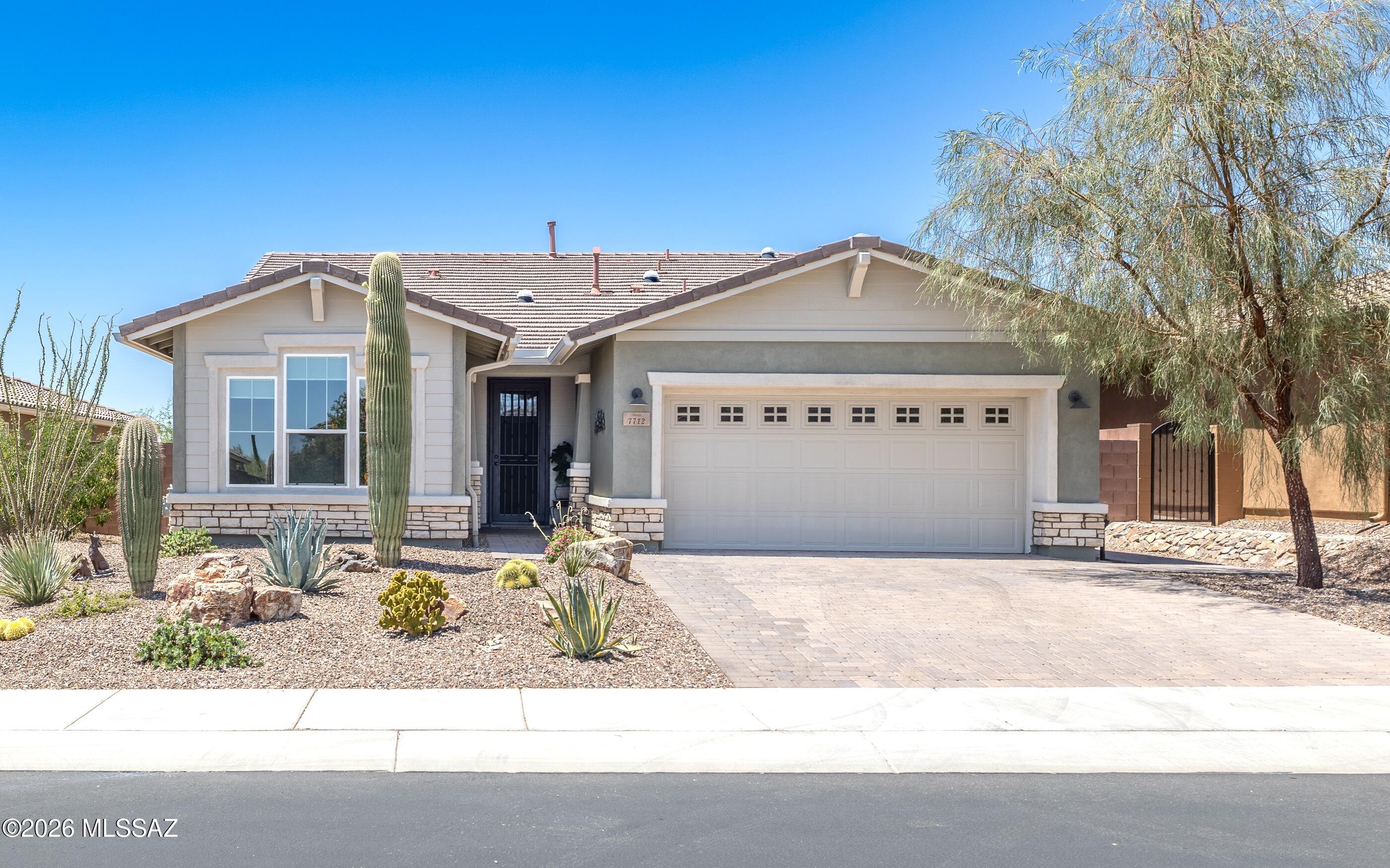 This extraordinarily well maintained Sycamore model in gated Blue Agave at Dove Mountain invites you to a new level of luxury living. Highly sought open great room concept floor plan that boasts an expansive yet relaxing and entertainment friendly gourmet kitchen w/stainless appliances, gorgeous granite counters & stylish cabinetry.  Rare & highly desired extra powder room accompanies this 2 bedroom + den/office easily living home. Both the primary bedroom & guest bedroom private retreat are spacious w/truly beautiful bathrooms. This 2022 built home is barely lived in yet boasts  having close to $90K in builder upgrades + an additional $40K+ of owner upgrades.  Outdoor living is spectacular w/sprawling porch & patio areas - view fencing that backs to nature.  Truly calm & peaceful living. Backyard is designed for relaxation -professionally landscaped w/nature blending plants & expansive brick pavers. Lot is pool sized and there is a conceptual pool design photo to show the potential.  This home is a must see in person  - walk through and sense the serenity of neutral and calming colors, finishes and views. Sonoran Desert living at Dove Mountain means enjoying outdoor living at its best. That lovely "cooing" sound you hear in the evenings may be the gentle Inca Doves which live in the area and give this elegant enclave its name. Nestled in the beautiful Tortolita Mountain Foothills, Dove Mountain is perhaps the epitome of Southwest desert living. The temperate climate allows residents to enjoy an indoor/outdoor lifestyle virtually all year-round, not just in in the fall, winter and spring seasons for which the region is famous. The wildlife of Dove Mountain is fascinating. The Sonoran Desert is home to species like the Great Horned Owl, the Black-chinned Hummingbird, Gambel's Quail, the Hooded Oriole and the Cactus Wren, Arizona's official bird. The lifestyle here is fascinating, mesmerizing, graceful, luxurious and fun. Perhaps your own Dove Mountain story is just beginning -at this lovely move-in-ready, highly upgraded gated subdivision home.