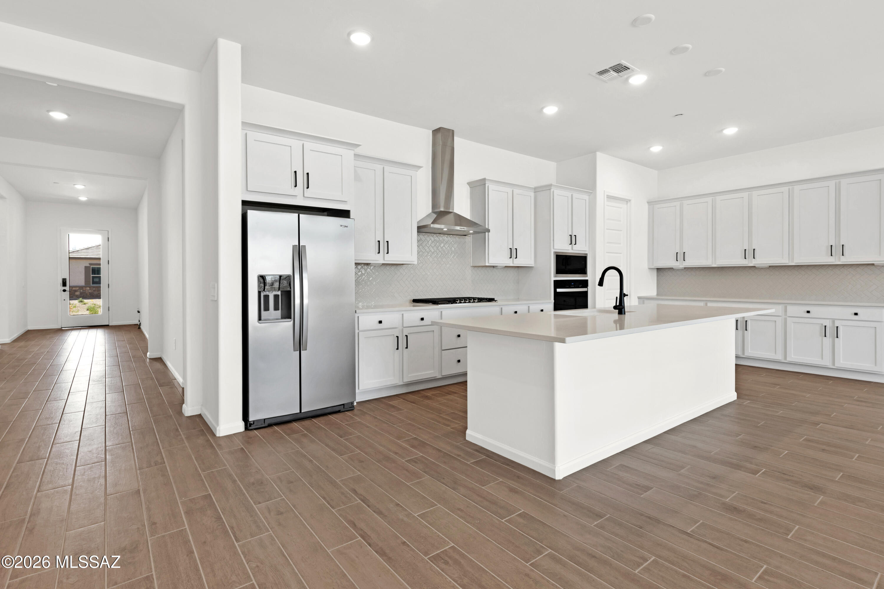 Oxford plan/Desert Modern elevation. This thoughtfully designed layout includes an open greatroom area with spacious kitchen & dining area. Convenient Stop-n-Drop area just in from the 4-car tandem garage for organization & a place to charge your devices. The Owner's suite is a retreat with a huge walk-in closet, a beautifully tiled walk-in shower, and dual vanities & linen closet. The modern Gourmet kitchen is equipped with a gas cooktop, refrigerator, center island and a walk-in corner pantry for all your culinary needs. Enclosed study provides extra room for studying, hobbies and more. Laundry room is complete with Washer/Dryer. Includes 2'' faux wood blinds.