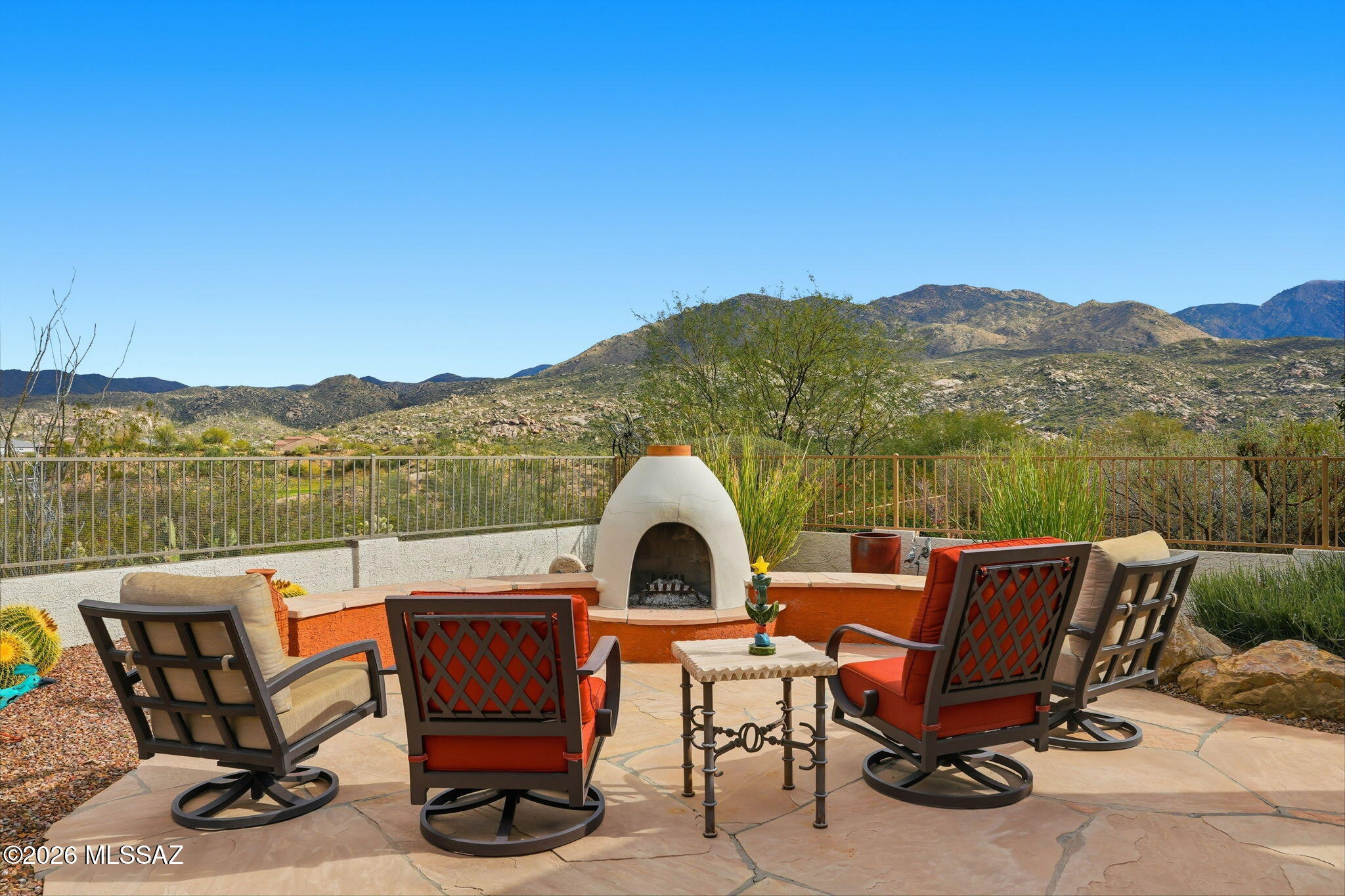Spectacular mountain views from inside and back patio of this Durango home. Living room features a cozy gas fireplace while the family room and kitchen capture mountain views. Primary suite offers a sitting area, walk-in closet, soaking tub and shower. Upstairs casita w/two bedrooms and updated bath, perfect for guests. No carpet - tile and luxury vinyl flooring plus shutters throughout. Enjoy outdoor living with expansive flagstone patio, wrought iron and snake fencing, a kiva fireplace, and a gas line for grilling. Charming side patio boasts southern sun and citrus trees - tangelo and Meyer lemon. Additional features: updated irrigation, security door, alarm system w/owned hardware, and 3-car garage w/updated water heater, recirculation pump, and loop for a water softener.