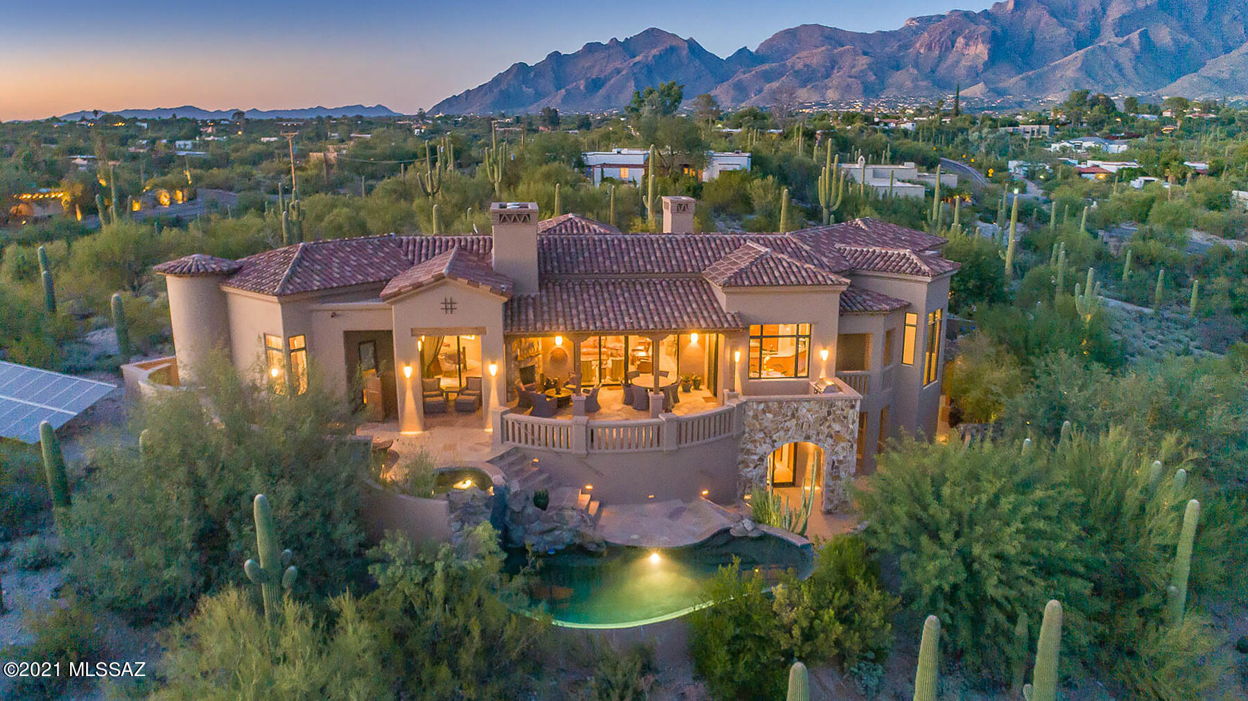 Modern Soft Contemporary Architecture designed by Kevin Howard. This 4BD/4BA (4,402 sq ft) private home on 3+ acres, in the Catalina Foothills, provides soaring panoramic views! Oversized master suite boasts stone fireplace, room-size walk-in closet & luxury bath.  Chef's dream kitchen w/ leathered quartzite countertops, high-end appliances & plenty of storage. Great room features stone fireplace & open wall-length sliding patio doors maximizing the unobstructed views of Tucson & 3 sets of mountain ranges. The lower-level guest quarters include a den and private patios. Backyard oasis boasts grand patio, stone fireplace, built in BBQ, infinity pool w/waterfall & spa. Perfect for the most discerning buyer seeking architectural design combined with luxury, privacy & unobstructed views.