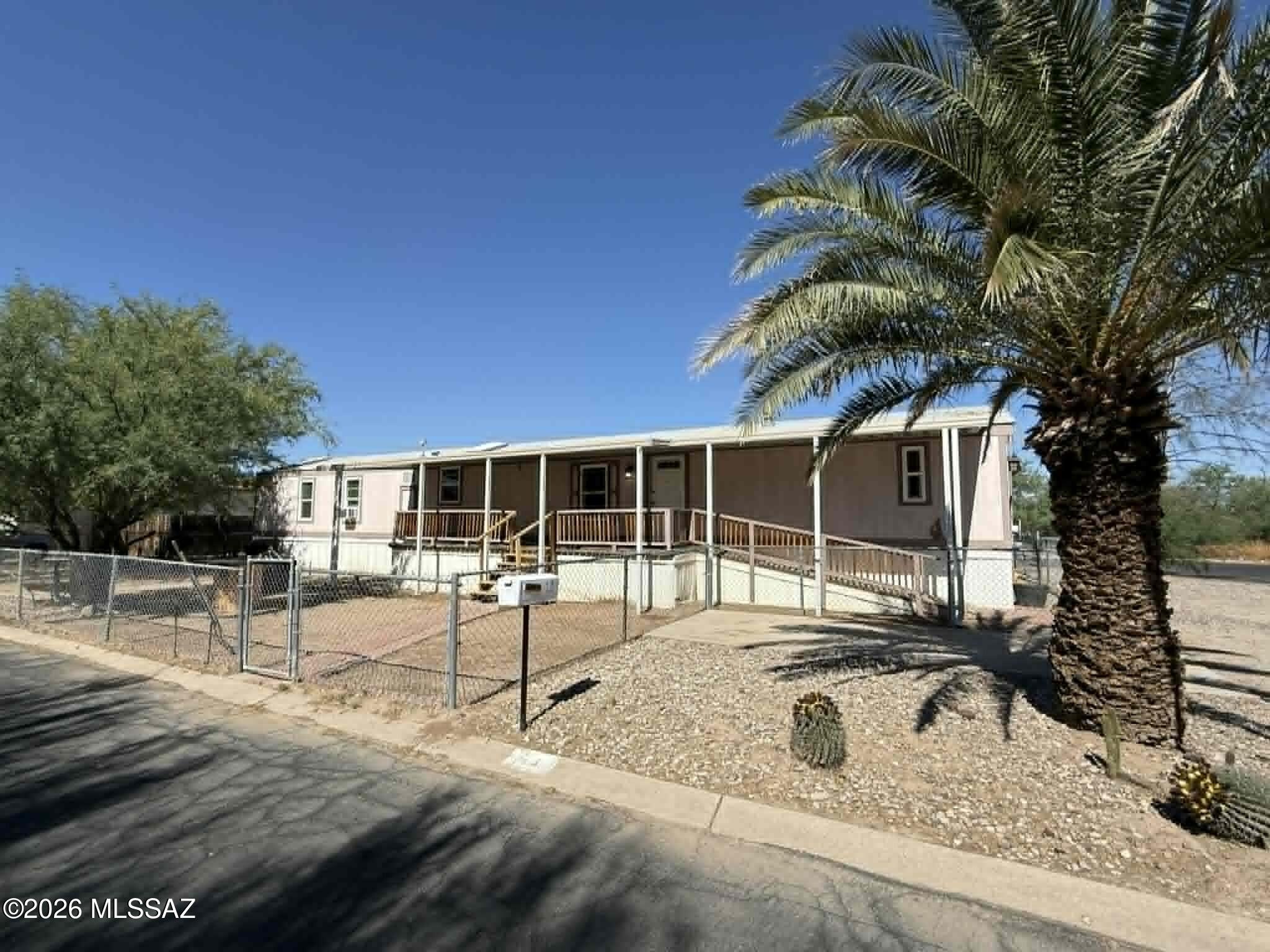 Spacious 3 bedroom, 2 bathroom mobile home offering approximately 1,200 sq. ft. of comfortable living in a smaller, well-maintained community in Tucson. This home features wood plank flooring throughout with no carpet, giving it a clean and modern feel. The open layout includes a functional kitchen equipped with a refrigerator, stove, dishwasher, and microwave. Additional interior highlights include vaulted ceilings, ceiling fans, central air conditioning, and in-home washer and dryer. The primary living spaces are bright and practical, designed for everyday comfort. Outside, enjoy a large enclosed fenced yard and private patio space, ideal for pets or outdoor relaxation. Residents also have access to a community pool, perfect for cooling off during Arizona summers.
Trailer is ''As Is''