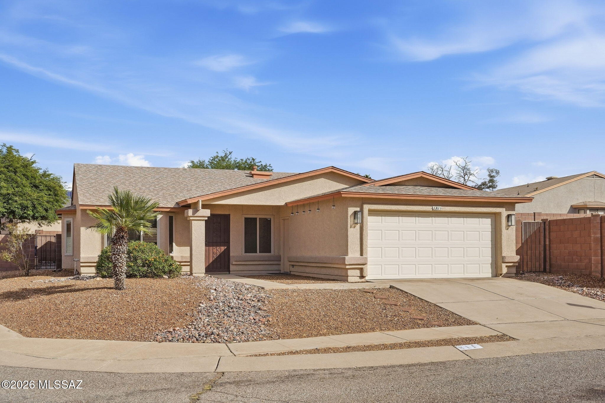 Welcome to this move-in-ready, single-story home on Tucson's east side! Situated on a corner lot, this 4-bedroom, 2-bath home offers a spacious, open layout with wood-look flooring throughout the main living areas. The kitchen features granite countertops, abundant cabinet space, and opens to the great room and dining area, perfect for everyday living and entertaining. The primary suite includes a private bath with an updated tile surround. Step outside to the east-facing backyard featuring an extended paver patio, covered seating area, and plenty of space to relax, entertain, or make the space your own. Enjoy the convenience of the community pool and spa just around the corner. With plenty of space, thoughtful updates, and a great east-side location, this home is ready for its next owner!