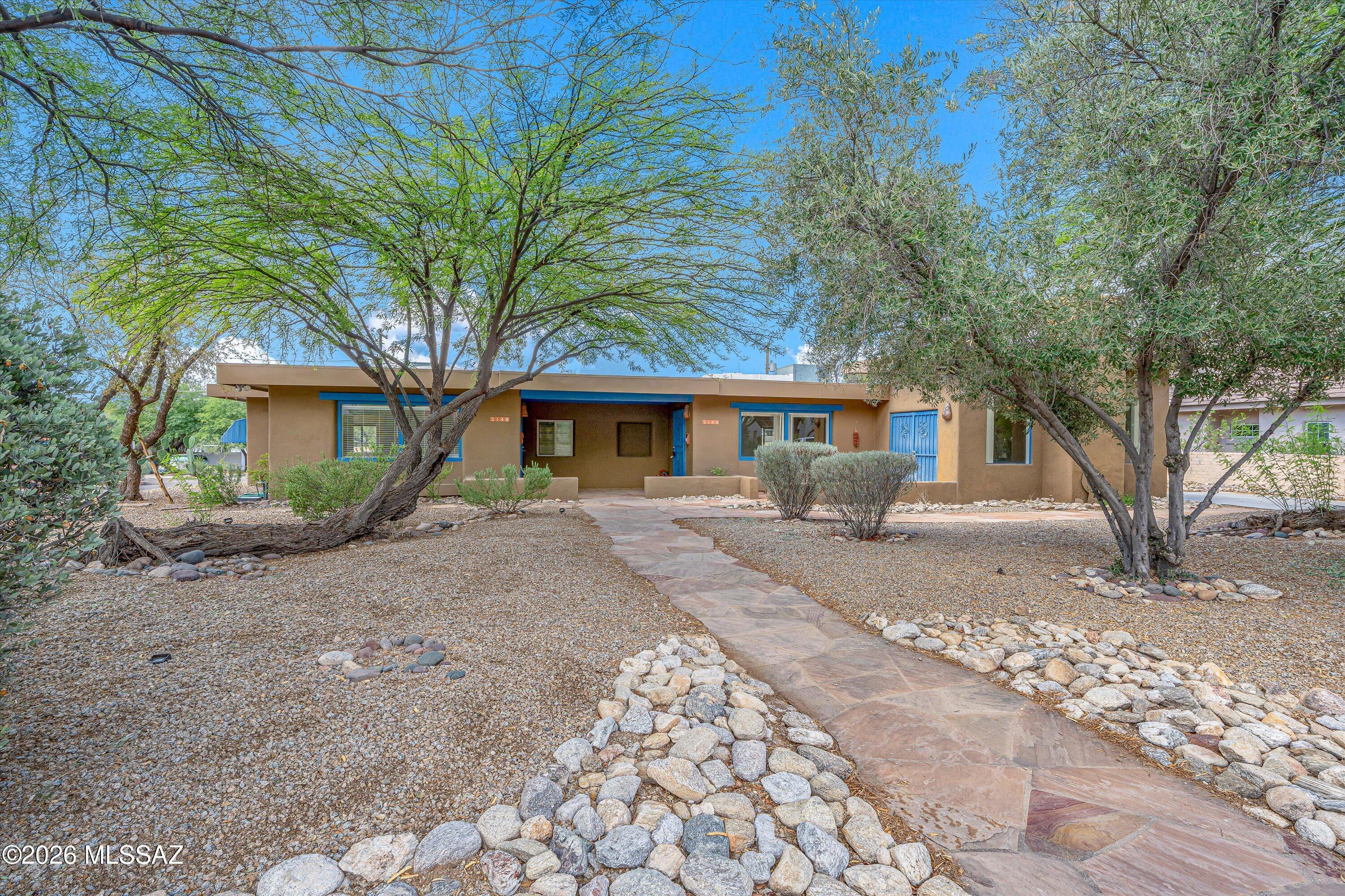 Exceptional opportunity just blocks from the University of Arizona in the historic and highly desirable Sam Hughes neighborhood! This unique property features a duplex plus a detached studio, offering exceptional flexibility and income potential. The main residence offers two spacious bedrooms, each with its own ensuite bathroom, an updated kitchen, and generous living and dining areas. The second unit is a charming one-bedroom, one-bath home filled with character, while the detached studio provides the perfect space for a home office, guest quarters, or additional rental possibilities. Whether you're looking to owner-occupy while generating rental income or expand your investment portfolio, this property offers endless possibilities. Recent improvements include a newly coated roof, freshly painted interiors, and sewer lines that have been professionally jetted and cleared to the street. Move-in ready in one of Tucson's strongest and most consistent rental markets!