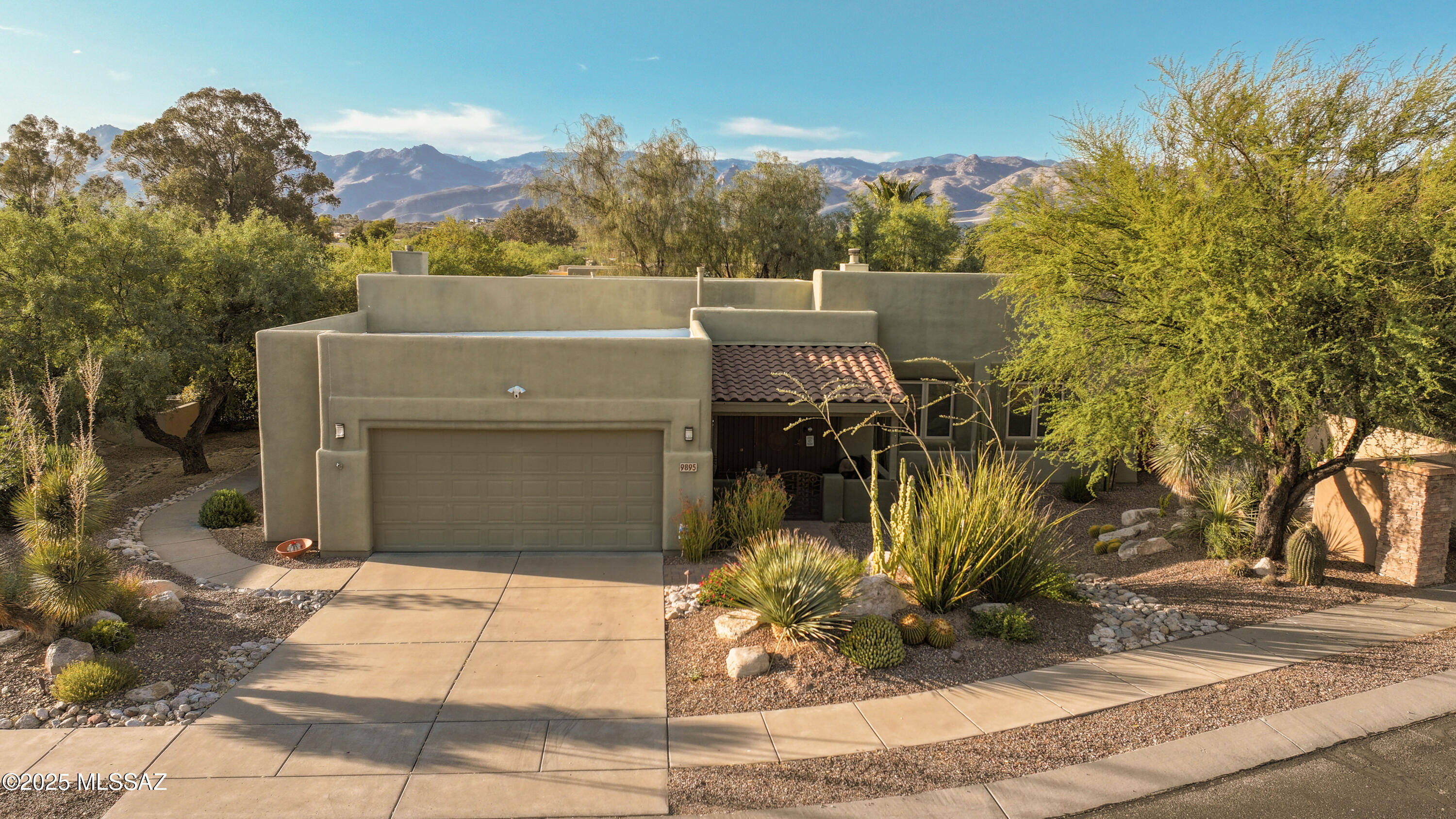 Welcome to a superb custom home, built in 2001, and tucked away in a tranquil enclave of just 20 residences in NE Tucson.  The front-yard fountain welcomes you into this 2,827 SF residence, which offers four bedrooms, two baths, & a split bedroom floor plan that blends quality craftsmanship with elegant finishes and modern comforts. 
The spacious Great Room features a stacked-stone gas fireplace, soaring wood-planked ceilings with exposed wood beams, updated Rogo's polished concrete floors, & newer custom sliding glass doors.  The chef's kitchen offers granite slab counters, a tumbled travertine backsplash, & rich knotty alder cabinetry.  A full suite of stainless-steel appliances includes a gas range with vent hood, refrigerator, microwave, and dishwasher. The space is anchored by a generous island with a breakfast bar, complemented by a wine rack, a walk-in pantry, and a convenient built-in kitchen desk.  Updated lighting and strategically placed solar tubes enhance the natural brightness, making this the heart of the home.
The primary suite includes a serene retreat, featuring a cozy two-way gas fireplace, a spa-like bath with soaking tub, walk-in shower, and executive-height dual vanity, plus a custom walk-in closet with built-ins and private access to the backyard.
Enjoy outdoor living on a private 0.3-acre lot, featuring a professionally landscaped yard (over $30k invested) with citrus trees.  The wraparound covered patio with brick pavers and an outdoor wood-burning fireplace provides a tranquil setting 
Additional Home Amenities:
" Two 15 SEER HVAC systems (Sept 2025) with transferrable warranty
" Roof recoated in 2024
" Pella windows throughout
" Portico installed in 2017
" Accura security system (2017) 
" Garage enhancements: overhead storage rack, epoxy flooring (2021), replaced springs & openers (2022), plus added storage 
Nearby Amenities:
" Isabella Lee Preserve in Tucson is a mesquite bosque supporting year-round birdlife.
" Nearby Sabino Canyon and Mt. Lemmon
" Morris K. Udall Park offers sports fields, playgrounds, trails, a splash pad, a dog park, and an outdoor court
" Rillito River Park / The Loop: multi-use trails nearby that connect many of Tucson's greenways
" Shopping and Restaurants
With numerous upgrades and a serene private setting, this residence offers luxury living close to shopping and recreation.  Don't miss the opportunity to make this home your own oasis in a desirable community.