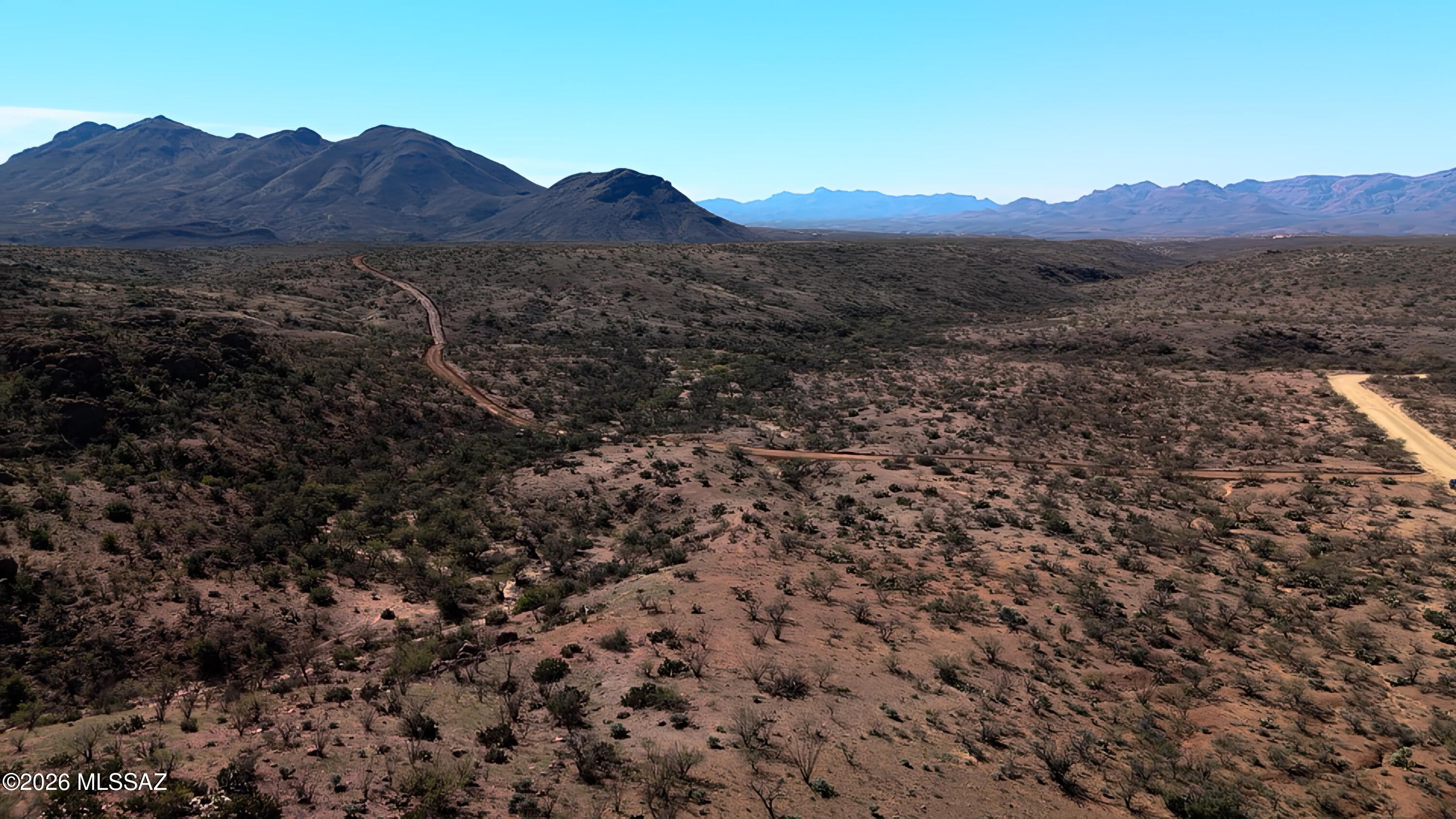 Escape to natural beauty on 36-acre vacant land property found only in East Rio Rico, Tubac Foothills Ranch, Santa Cruz County in Southern Arizona. Where else can you own your own canyon? Complete with varied plant, bird and wildlife and rimrock features, you can explore for hours. Varied rolling terrain, plus an ideal highpoint location for building your custom home, with a Passing Percolation Test done. From your porch enjoy fabulous wide-open views of the Santa Rita, San Cayetano & Tumacácori mountains. This spectacular location has easy access, only a 15-minute drive to Rio Rico I-19 Exit 25 Palo Pardo. Come take a look soon!