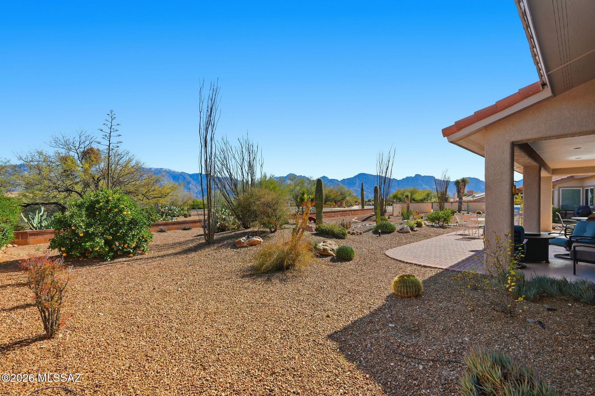 Welcome home! This extended and beautifully remodeled Sabino Model offers 2 bedrooms and 2 baths with magnificent Catalina Mountain views. The light-filled home features recessed lighting, tile in main living areas, and carpeted bedrooms. The cook will enjoy the kitchen with a Bosch refrigerator, gas range, ample storage, a serving counter/coffee bar, and beverage cooler. Both baths have been tastefully updated, and California Closets provide excellent organization. A convenient office with built-ins is located just off the kitchen. Enjoy east-facing patio living while watching the sun rise over the Catalinas. Lennox HVAC (2016) and roof underlayment replaced. Don't miss this one!