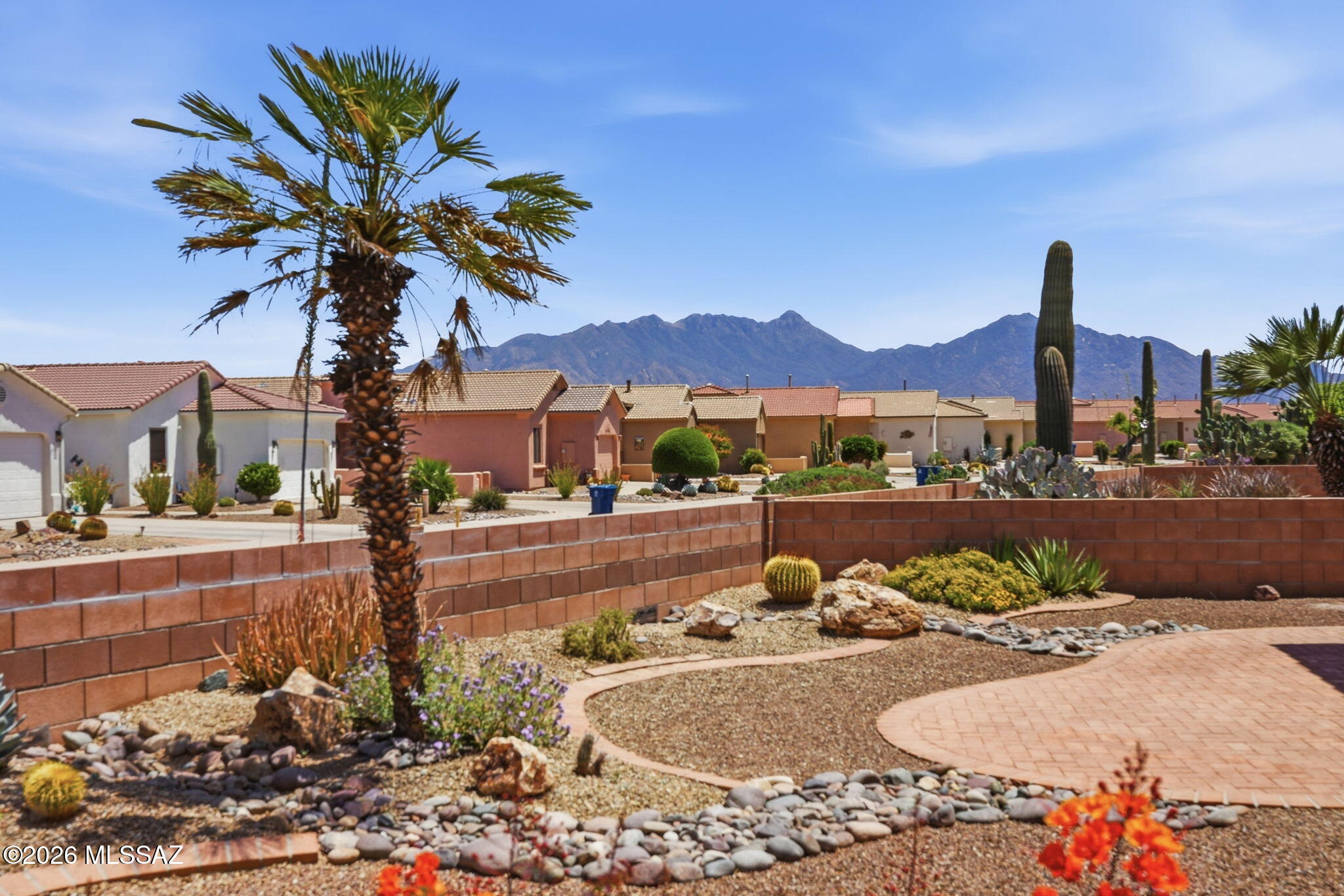 Experience comfortable, easy Southwest living in this well-maintained 1,599 sq. ft. home, ideally situated in the heart of Green Valley. Offering 2 bedrooms, 2 bathrooms, a versatile den, and a 2-car garage, this home is thoughtfully designed for both everyday comfort and relaxed entertaining.

A spacious front courtyard creates a warm welcome and provides a private setting to enjoy morning coffee or quiet afternoons. Inside, the open great room is filled with natural light and centered around a cozy fireplace, adding both charm and a sense of comfort. The adjoining kitchen is designed to stay connected to the living space and features granite countertops, white appliances, generous cabinetry, and a functional layout that makes hosting simple. The split-bedroom floor plan offers privacy, with the primary suite serving as a peaceful retreat. The guest bedroom includes a Murphy bed with built-in desk, giving you flexibility for visiting friends and family while maintaining a practical workspace. The den adds additional versatility for hobbies, reading, or a home office.

Step outside to the spacious backyard and take in mountain views, a perfect backdrop for enjoying Arizona's beautiful sunsets. Conveniently located near golf, recreation centers, shopping, and dining, this home offers a refined yet low-maintenance lifestyle ideal for both seasonal and full-time living.