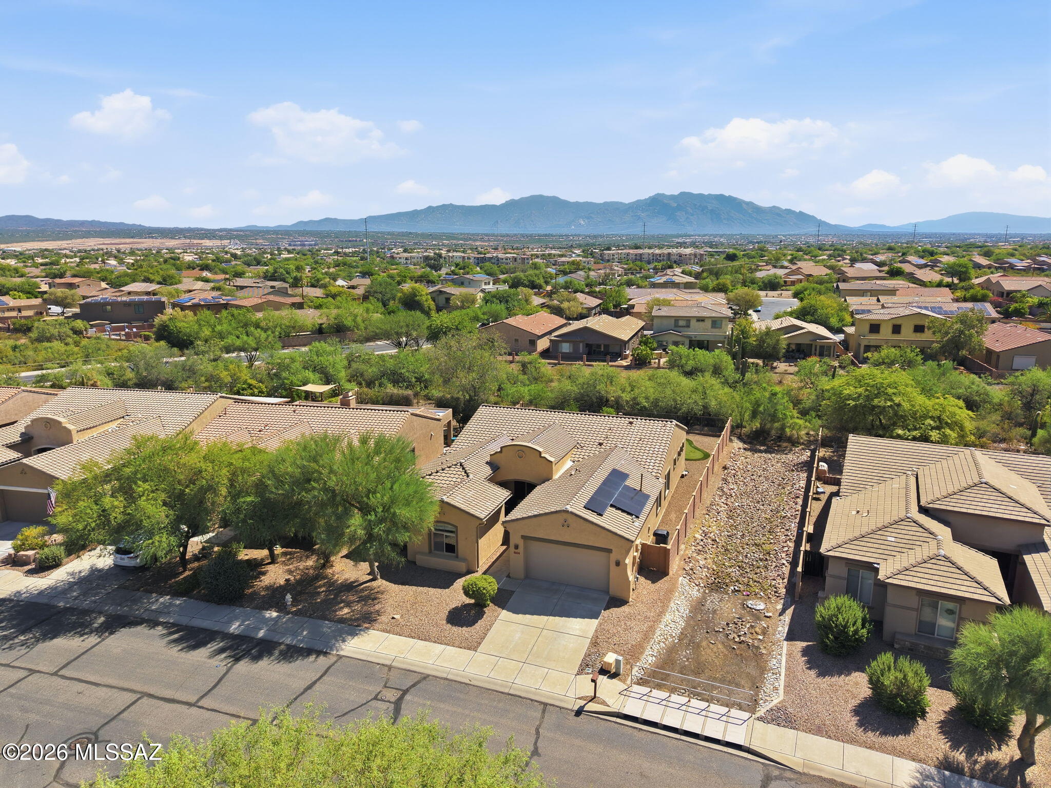 Beautiful Ironwood Reserve home offering 2,734 sq. ft., 4 bedroom, 3 baths with an open floor plan. The light-filled great room features high ceilings, walls of windows and a beehive fireplace The Chef's kitchen offer granite, stainless appliances & a glass tile backsplash. The Spacious primary suite features a walk-in tub, separate shower & direct patio access. Enjoy the paver patio, putting green & peaceful open-space setting. This Split-bedroom plan is ideal for guests, plus a flexible office/craft/TV room. Upgrades include newer Trane HVAC, replaced roof underlayment, OWNED SOLAR for energy savings & whole-home water filtration. Perfect for Arizona living & entertaining!