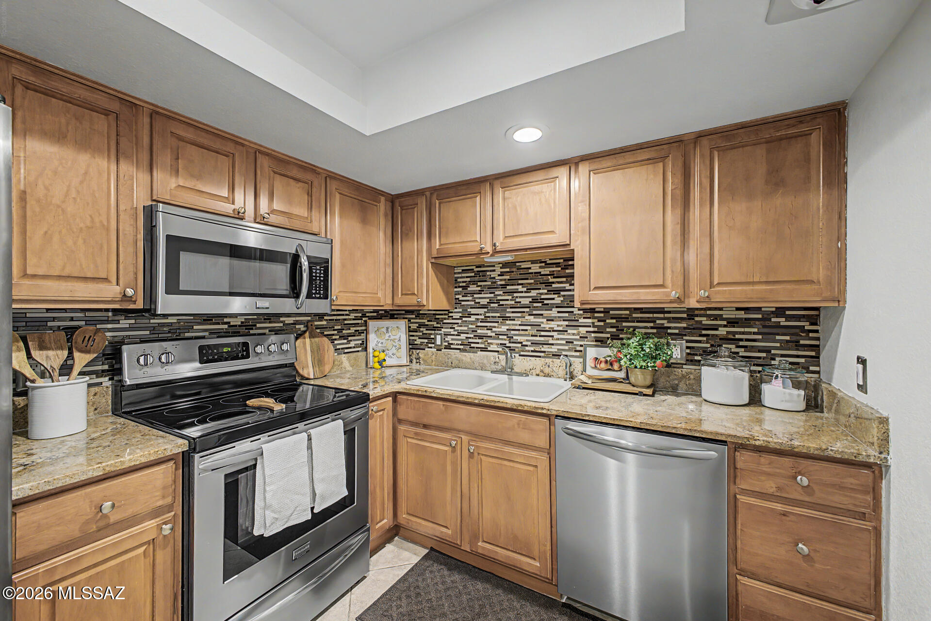 Welcome home to this beautifully updated condo in the heart of Oro Valley. Featuring stylish tile flooring throughout, this low maintenance residence offers a modern and inviting living space designed for comfort and convenience. The updated kitchen showcases granite countertops, ample cabinetry, and a functional layout perfect for everyday living and entertaining. Both bathrooms have been tastefully remodeled with contemporary finishes, adding a fresh and elegant touch. Enjoy the ease of condo living with exterior maintenance provided by the HOA, allowing you more time to relax and enjoy everything Oro Valley has to offer. Whether you're looking for a full-time residence, seasonal retreat, or investment opportunity, this well-maintained and updated home is ready for its next owner. Don't miss your chance to own this exceptional property in a desirable location close to shopping, dining, parks, and recreational amenities.