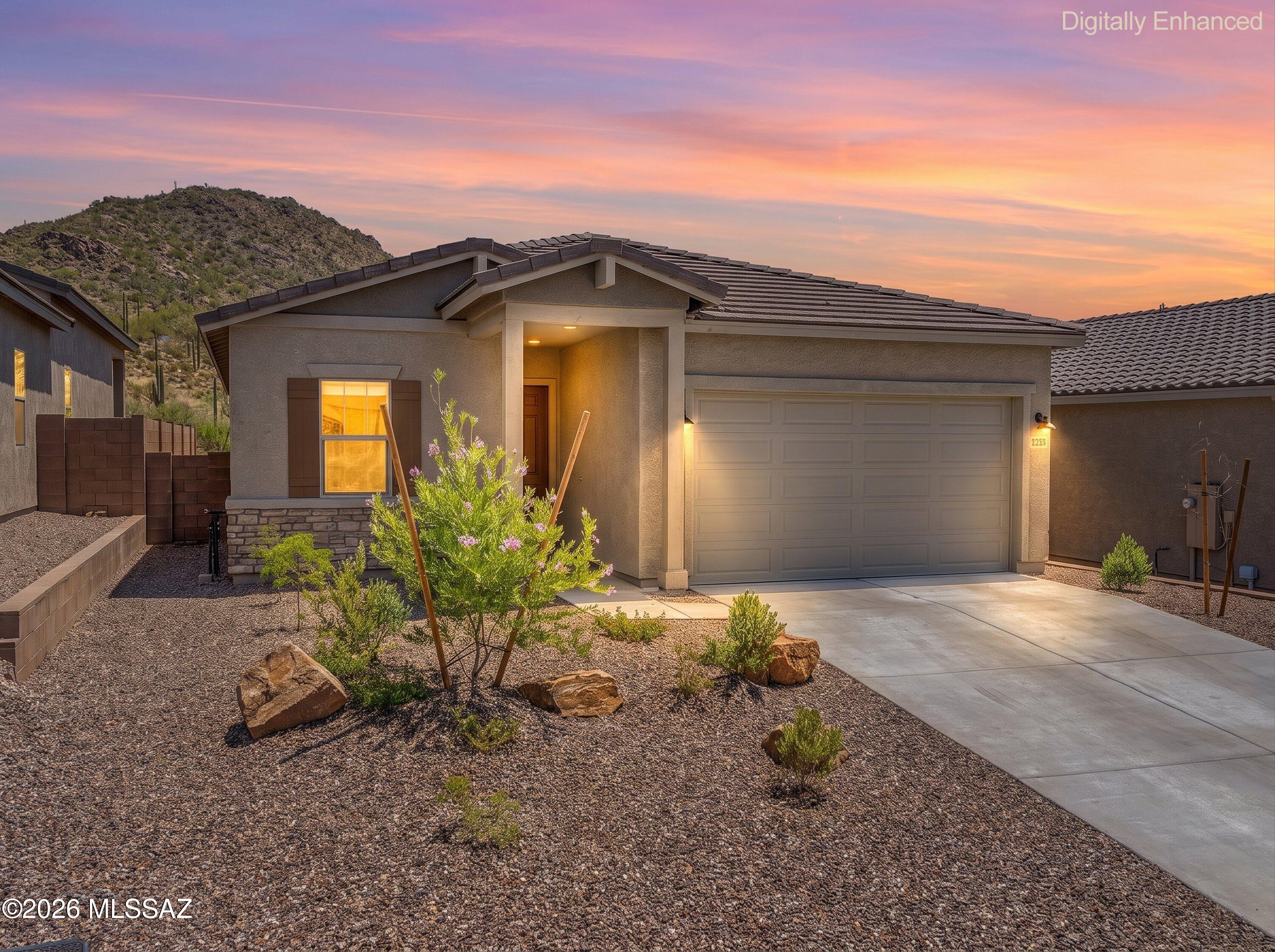 Priced below builder homes, save money with this ready go property. Welcome home to this beautifully maintained Brandy model with Ranch elevation, located in the desirable gated community of Saguaro Reserve II in Dove Mountain. This 2-bedroom, 2-bath home with a den offers 1,735 square feet of thoughtfully designed living space featuring an open-concept floor plan that's perfect for both everyday living and entertaining. The chef's kitchen showcases beautiful granite countertops, rich dark wood cabinetry, a large island with sink and breakfast bar, stainless steel appliances, and a spacious walk-in pantry. The inviting great room flows seamlessly into the dining area, creating a bright and welcoming atmosphere. The spacious primary suite features a large walk-in closet, dual vanities, .... .... and an oversized walk-in shower. Double doors lead to the versatile den, making it an ideal home office, media room, or flex space. The generously sized guest bedroom is conveniently located next to the guest bath with a tub/shower combination. Step outside to enjoy the private backyard with breathtaking Tortolita Mountain views, a covered patio, and newly installed landscaping with decorative rock, creating the perfect setting to relax and enjoy Arizona's beautiful sunset.