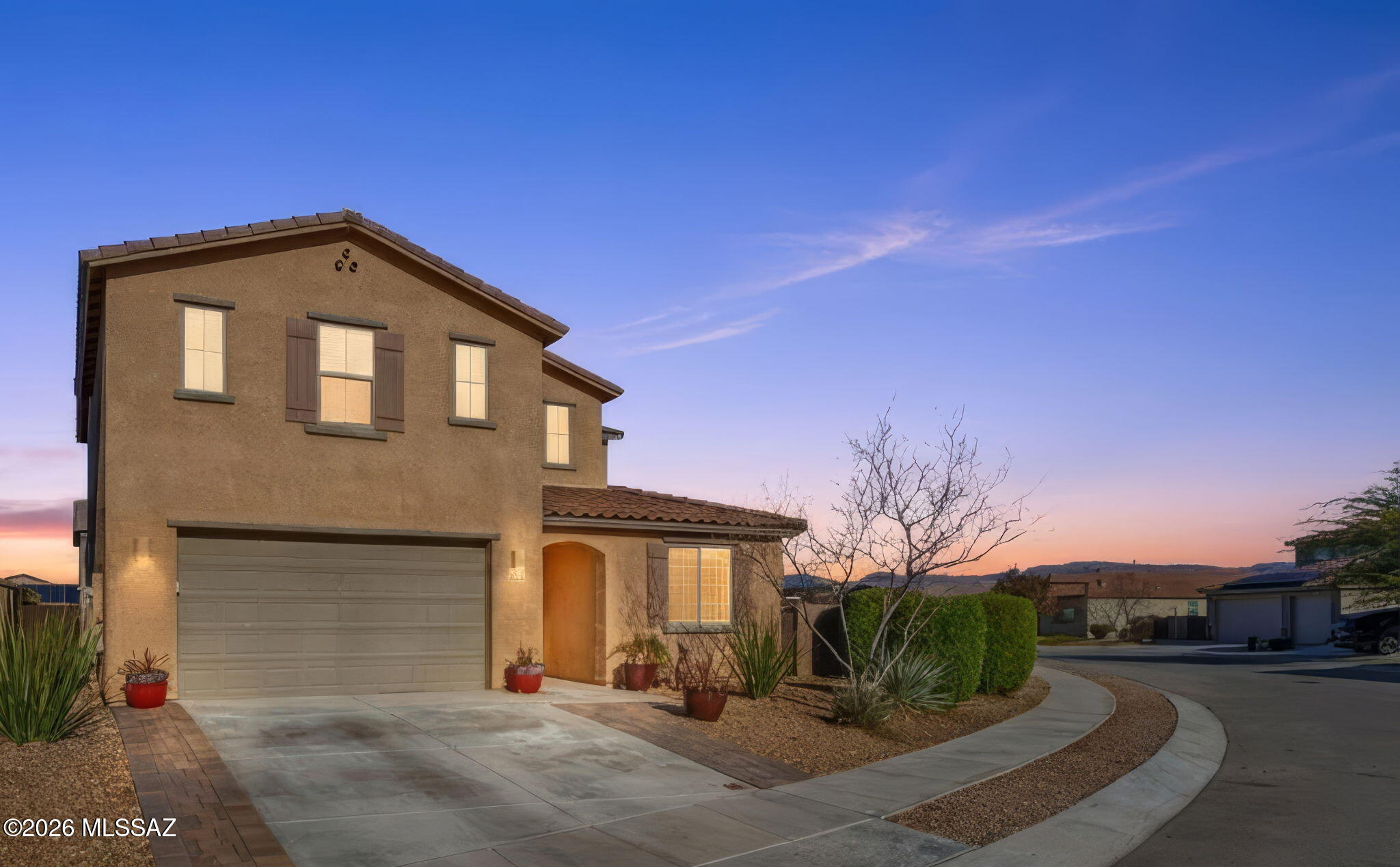 Welcome home to 2761sqft of upgrades and views on one of the largest lots (~10,500sqft) in the community in the award winning Vail School District. With 4
bedrooms, 3 full bathrooms, an office, and an upstairs loft, your home offers plenty of flexible space. The main floor features a large great room with an upscale,
open kitchen and dining room. The kitchen boasts a large island, upgraded cabinets, and a walk-in pantry. Off the foyer is a full bedroom and bathroom perfect
for a mother-in-law suite or guest privacy. At the top of the stairs is a loft space with mountain views and three bedrooms, including the primary retreat with a
large walk-in closet. The double-size large backyard is fully landscaped with trees and real grass, and plenty of room for a pool. The extended-length garage gives you extra room for larger vehicles and is a 3-car tandem garage.
Located on a desirable premium lot with extensive extra street parking. This beautiful, thoughtfully upgraded home is move-in ready for you. Located in the highly desirable La Estancia community where you will love the great selection of schools available within the sought after Vail School District. La Estancia has direct access to 'The Loop', an interconnected system of more than 130 miles of paved pathways and bike lanes, as well as two community pools, splash-pad, basketball court, pickleball courts, playgrounds, and more than 8 beautiful parks. La Estancia is within close proximity to many major employers, including Davis-Monthan AFB, Tucson International Airport, UA Tech Park, Raytheon and Amazon. Call for your private showing of this stunning upgraded home today!