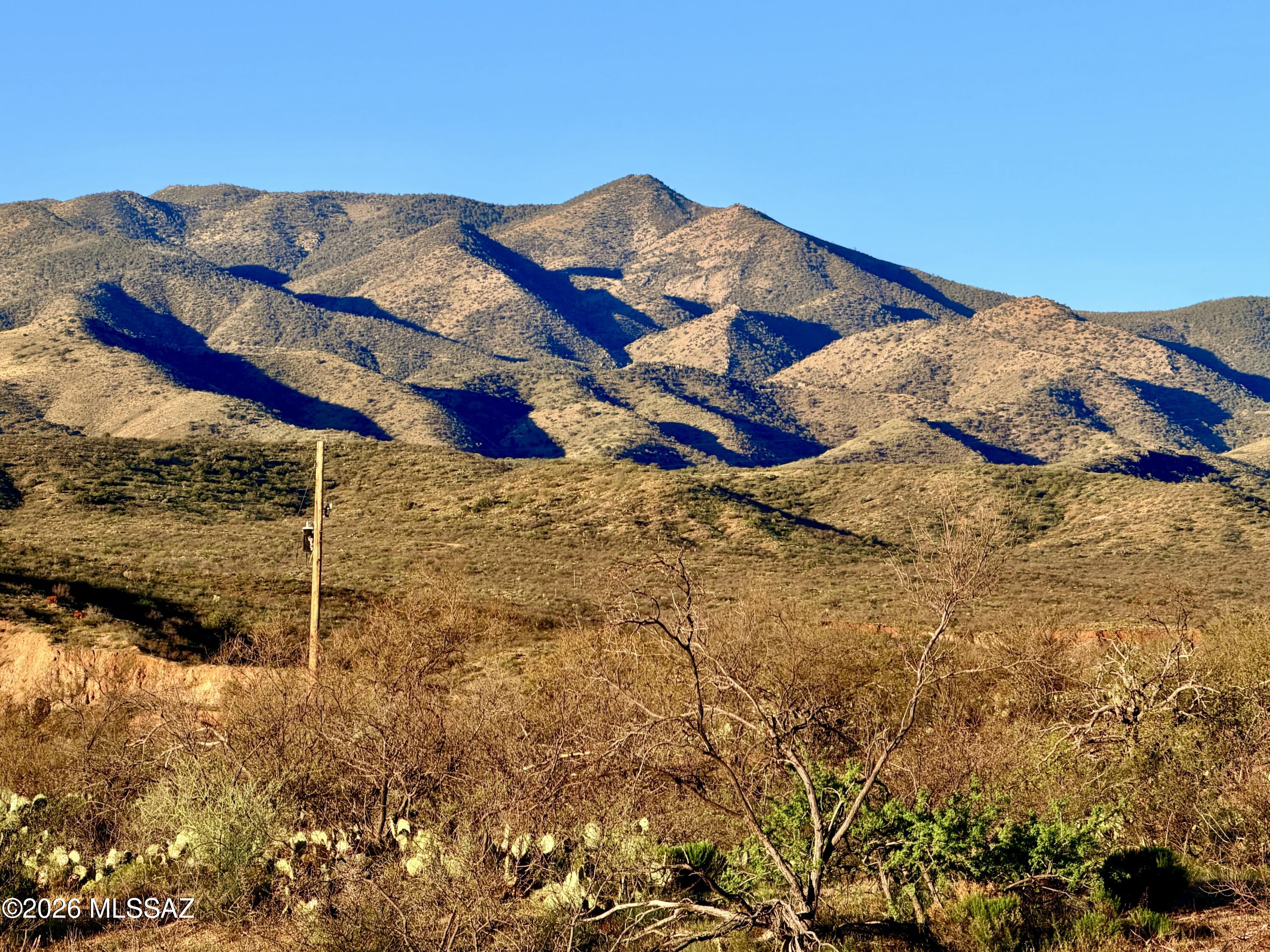 5 Acres with Stunning Mountain Views!
Enjoy wide-open space and breathtaking mountain scenery on this private 5 acre property. Easy access yet tucked away for peace and seclusion. Surrounded by natural desert vegetation, this off-grid parcel is perfect for those seeking privacy and a connection to nature. Hiking/horseback riding trails nearby, with National Forest and State Land close by for endless outdoor recreation. Horses are welcome--bring your animals and your vision!  Both, stick built and manufactured homes allowed.