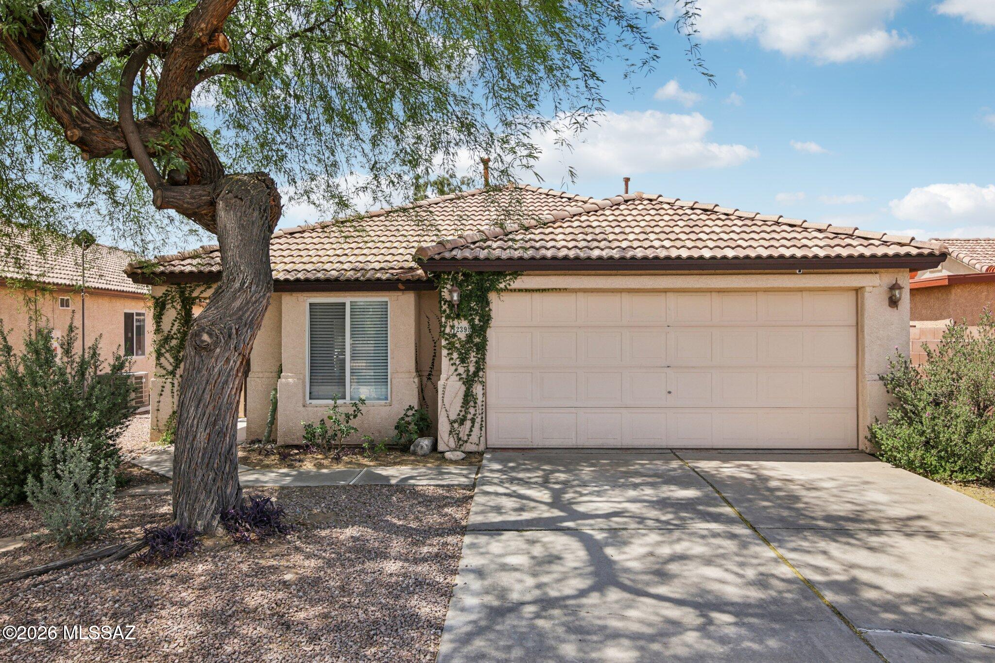 This well-maintained home is located in a quiet neighborhood. The property is close to shopping without feeling like being in the busy city. This home interior features custom cabinets, upgraded fans, window shades and appliances and custom closets for ample storage. 
Enjoy a low-maintenance backyard oasis with an extended patio, patio lighting, turf, shade trees and garden beds, while the front yard boasts a large mesquite tree for shade. Located directly across from the home is a fenced neighborhood park. Easy access to amenities like the bike path (The Loop), parks, hiking & mountain biking trails are minutes away.
AC (Carrier) replaced in 2019
Roof replaced in 2022
Water heater replaced 2023
Experience peaceful suburban living with convenient access to everything Tucson has to off
