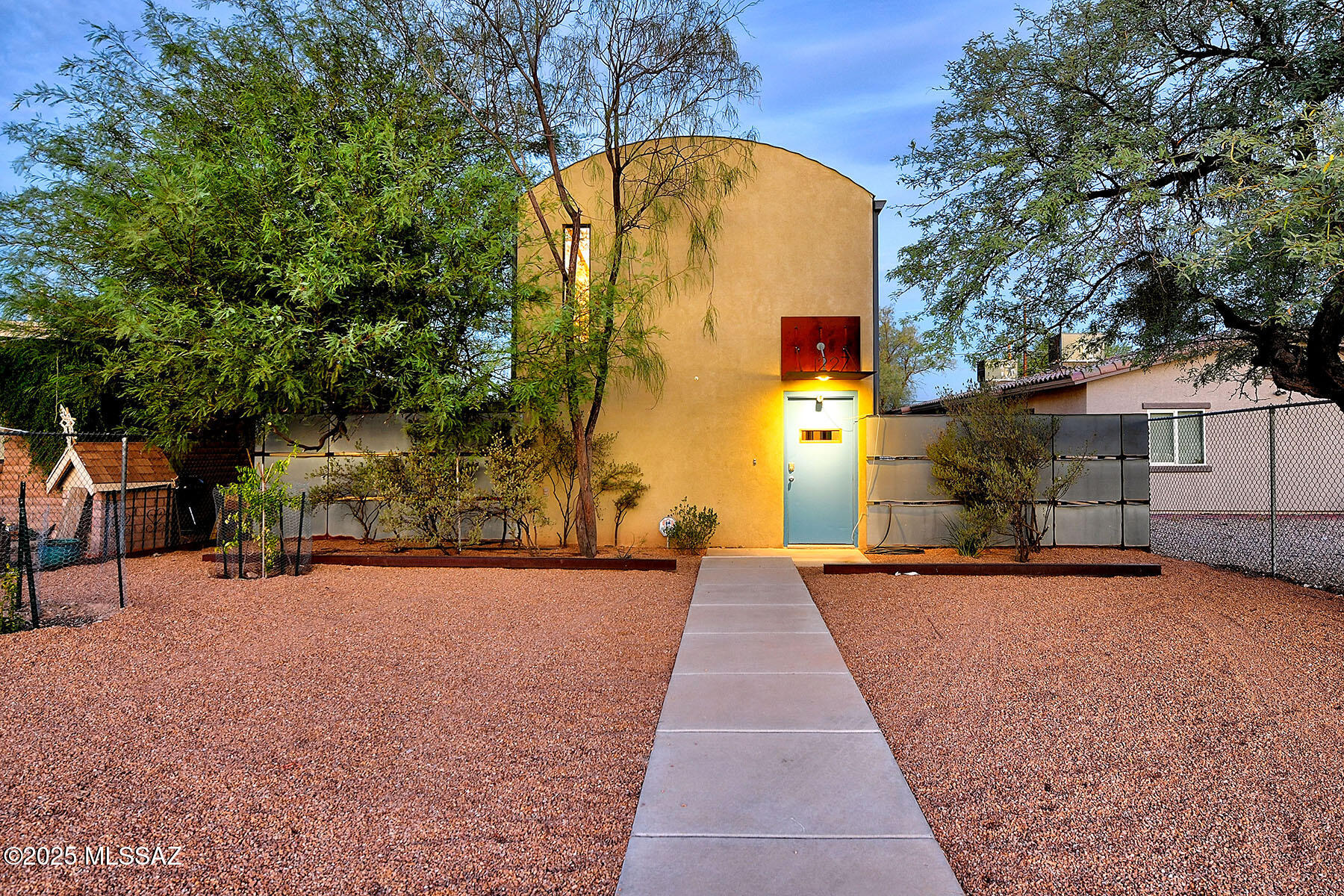 Known as ''The Slice,'' this striking duplex Built by Repp Construction, in the Blue Moon Barrio features modern architecture with a sleek contemporary design.  Each of the two identical residences features 3 bedrooms and 2.5 bathrooms, with light-filled great room lower levels. The kitchens boast an island, gas ranges, and flat panel cabinetry—perfect for entertaining. Multiple sliding doors open to private, walled courtyards on the north and south side of great room, ideal for indoor-outdoor living.  Bailey Ave side of the duplex is leased for $1,750 per month until 8/26.  1227 N 13th has freshly painted interior, new carpet upstairs, concrete floors re-stained and sealed, new oven and microwave! Upstairs, all bedrooms are generously sized with excellent closet space, while two full ba provide convenience and privacy. The thoughtful layout gives each unit the feel of a standalone home, with separate entrances one on 13th Street and the other on Bailey. This is a rare opportunity to live stylishly in one unit while generating income from the other. Located near downtown Tucson, UArizona & I10. Great opportunity to live in one and rent the other or rent both!