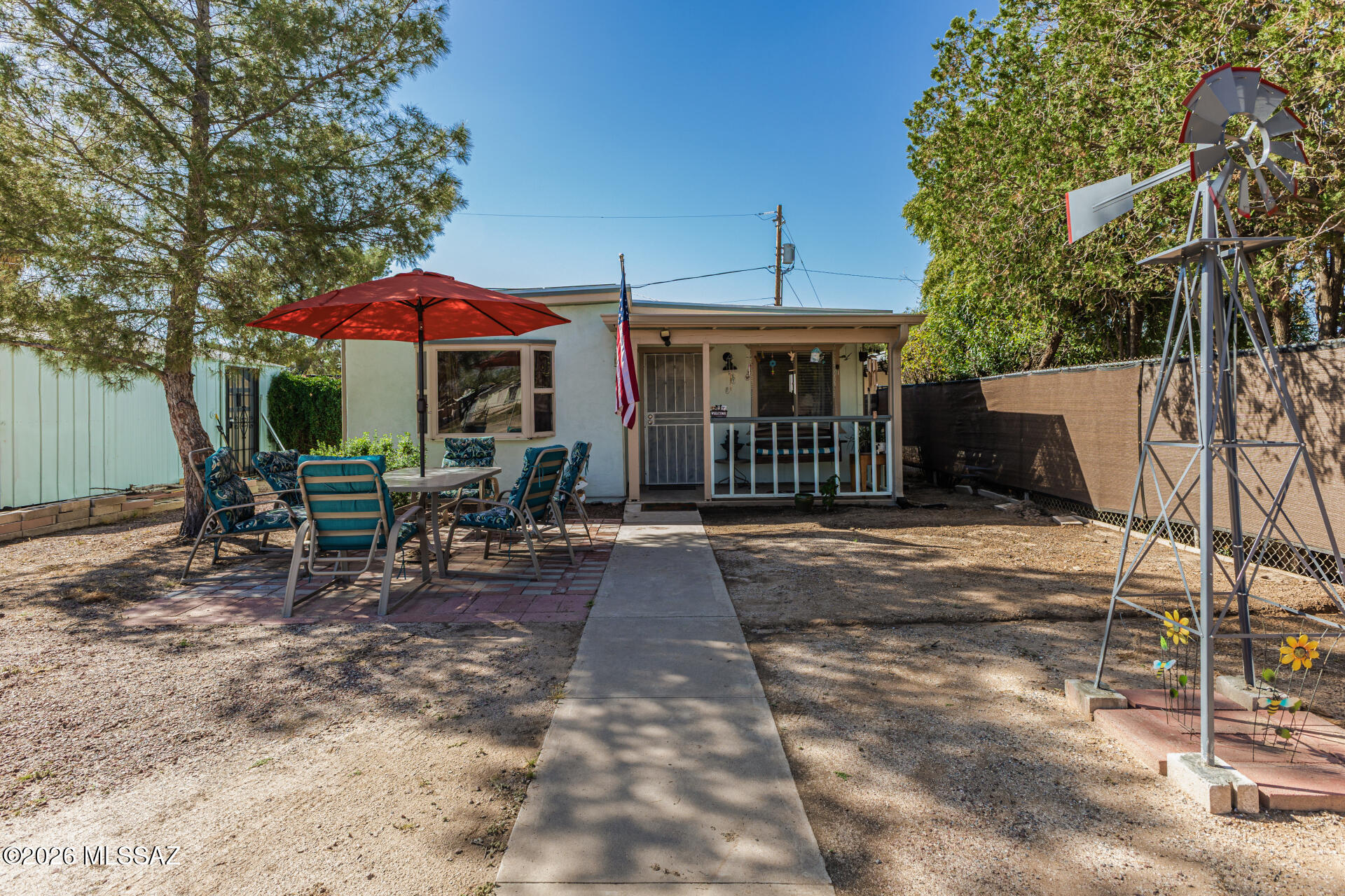 Charming 3BD/2BA bungalow in central Tucson! This inviting home features living and family rooms, offering flexible space to relax or entertain. The open kitchen and dining area includes ceramic tile flooring through the kitchen, dining area, baths, hall, and laundry room. Enjoy relaxing on the covered front porch. Detached 1-car garage with electricity--perfect for a workshop or storage. Located near Reid & San Gabriel Parks, Randolph Golf Course, El Con Shopping Center, and schools. Great for investors or first-time buyers!
