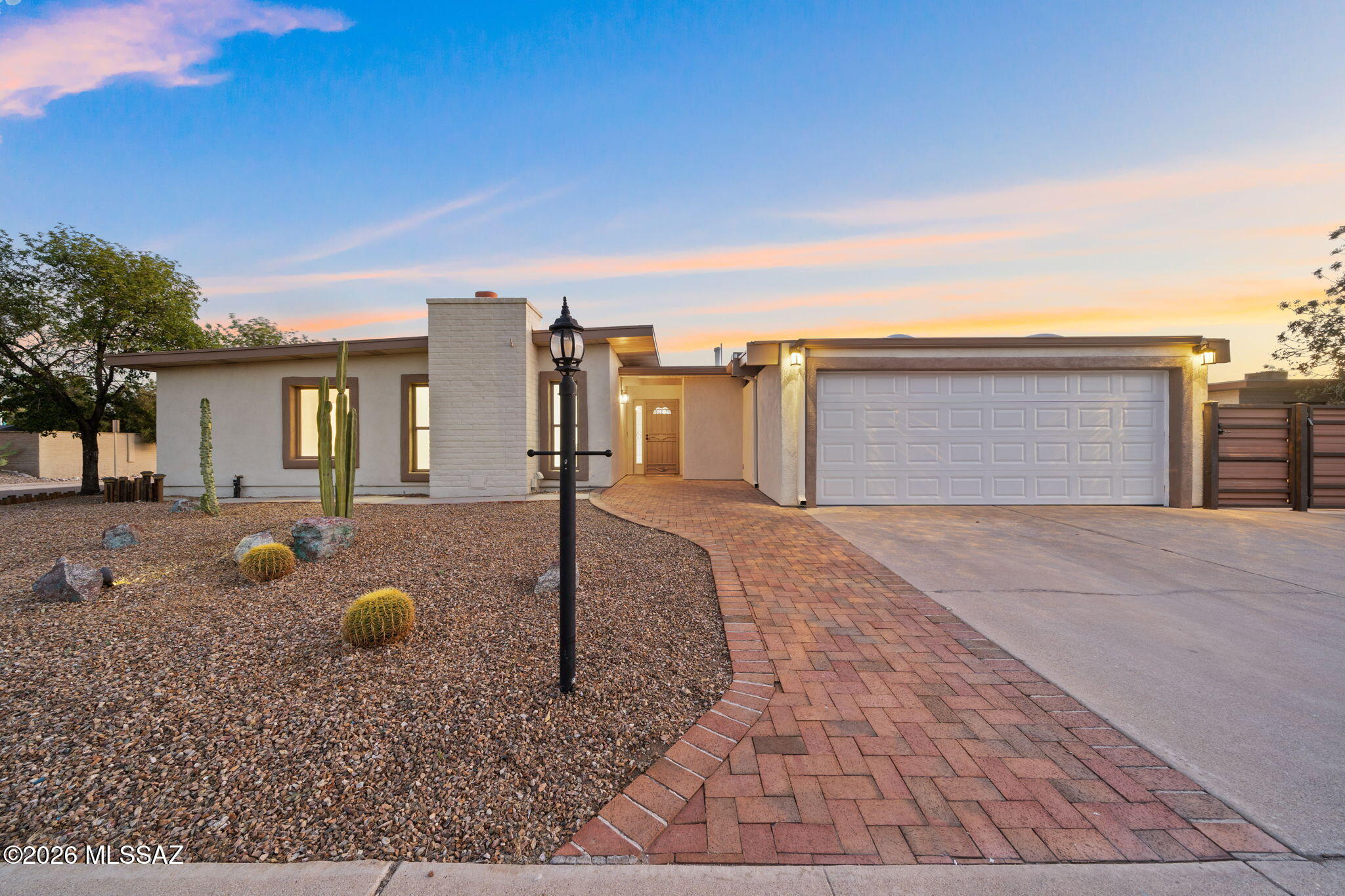 Just in time for Summer! Remodeled East side Tucson home with a sparkling pool & spa! No HOA here! This versatile floorplan offers 3 bedrooms, 2 baths + a Den/Office. Cozy Family room with fireplace, plus a Great room area featuring Dining space all open and connecting to the kitchen--perfect for everyday living and entertaining. Recent updates include New flooring throughout (No carpet here!), New paint, New Lighting, New garage door, New pool & spa plaster, and a NEW HVAC system installed in March 2026. Step outside to enjoy your paradise of a yard featuring a large covered patio, charming kiva fireplace, and spacious turfed area. Double gate access provides room to park your RV, boat, or toys in the side yard. Move-in ready and packed with updates! Come check it out!