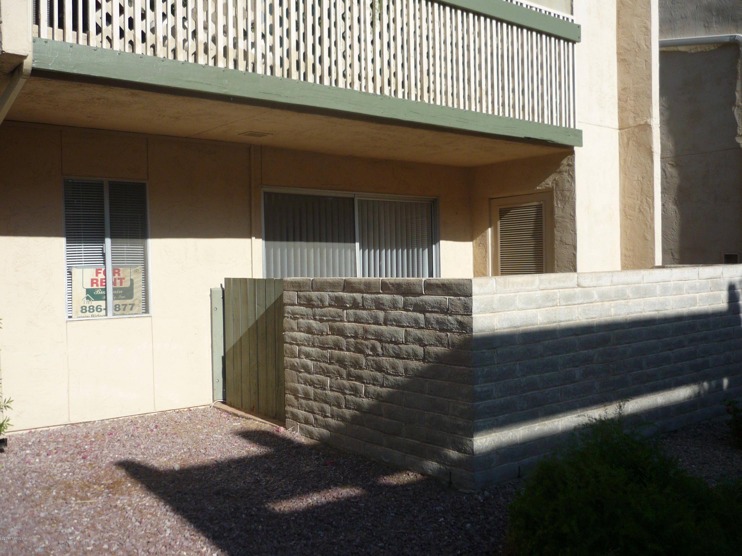 Charming condo w/small patio, ground floor unit.  Wood laminate tile flooring throughout.  Owner pays assoc  fee.  Swimming pools & laundry facilities on site.  Water included in rent.  1 covered parking space.