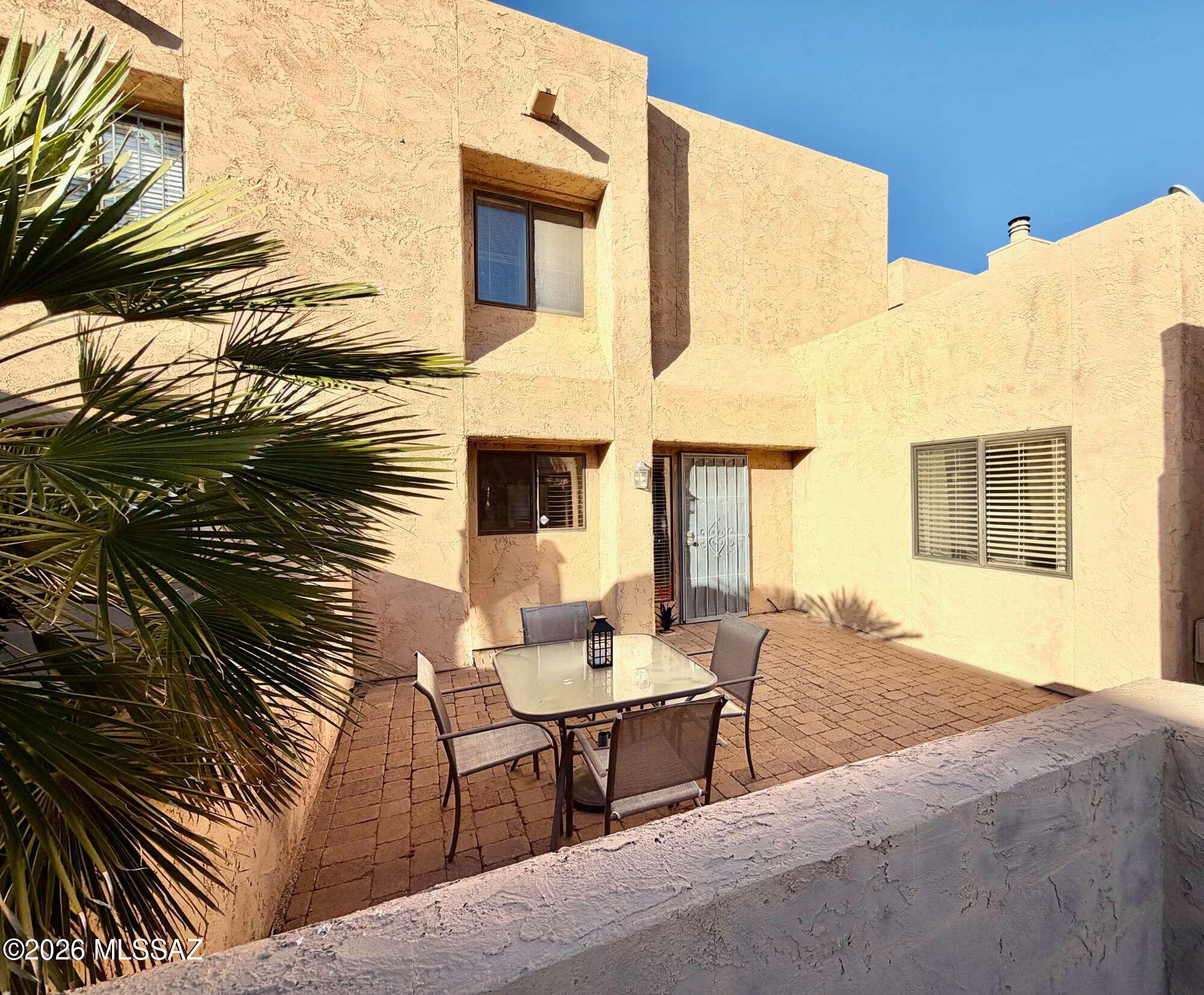 Come view this upgraded 2bd/2ba townhouse located in Winterhaven Townhomes. Dining area off kitchen opens up to living room great room with soaring ceilings. Kitchen has been upgraded to include stainless steel appliances, granite countertops, recessed led lighting and good amount of storage space. Backyard has a good seating space with a view of the Catalina Mountains. There is one bedroom downstairs as well as a full bathroom. The primary bedroom is located upstairs and boasts a full bathroom, walk in closet, personal fireplace and views of the Catalina Mountains. Flooring throughout is either ceramic tile or engineered wood - NO carpet. The community contains pool and spa to enjoy on those hot summer days. HOA includes water. Washer/Dryer included.