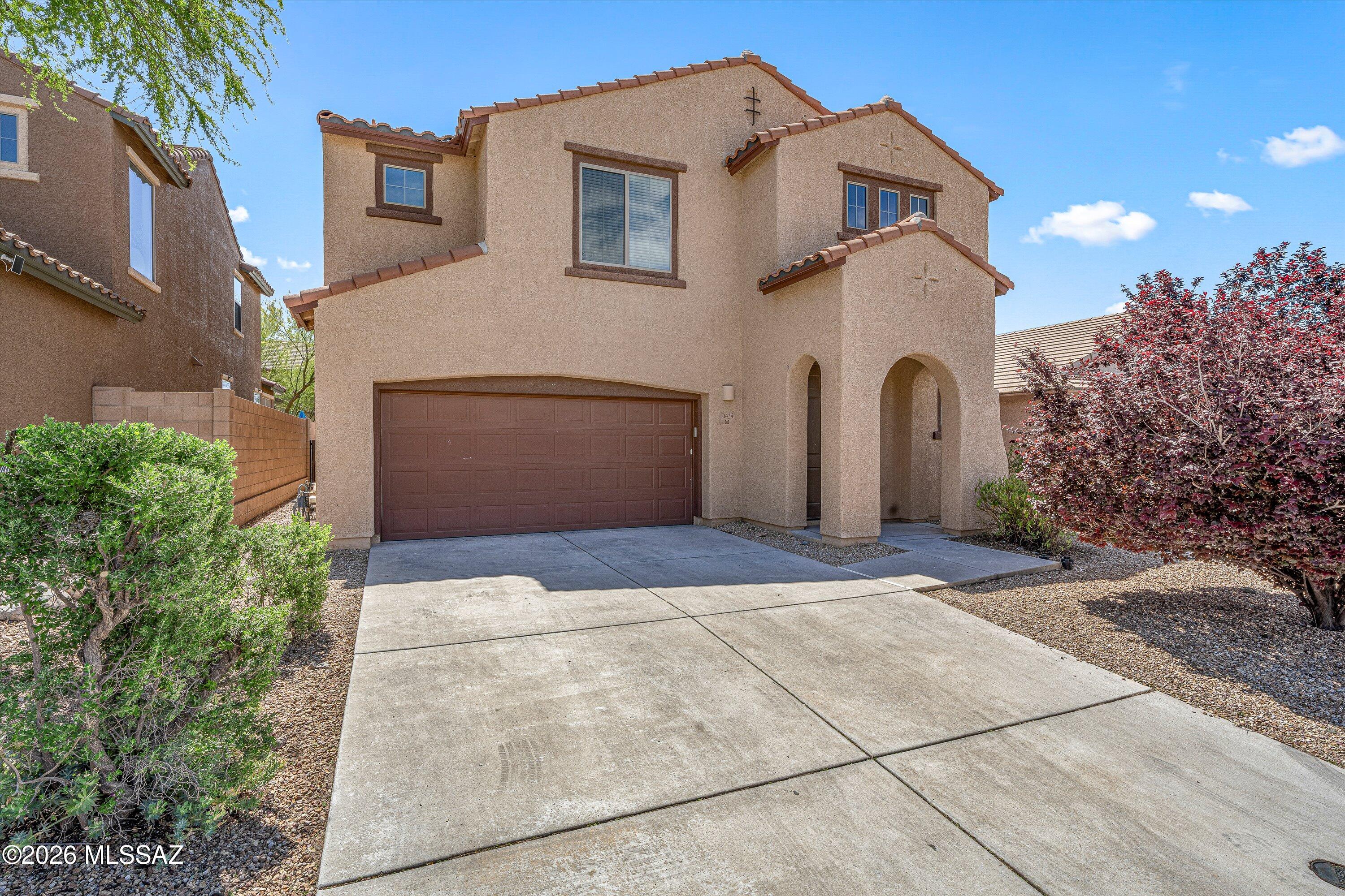 Spacious and bright 4-bedroom, 2.5-bath home offering 2,250 sq ft of comfortable living! Fresh new paint and carpet throughout make this home truly move-in ready. The tandem 3-car garage provides extra space for storage, hobbies, or additional parking. The inviting eat-in kitchen is perfect for everyday living and entertaining, featuring a gas range, stainless steel appliances, double oven, and a large island with seating. A sliding glass door leads directly to the patio and low-maintenance turf backyard--ideal for gatherings and relaxing. The open floorplan includes a dedicated dining area and has a versatile loft upstairs for additional living space. The spacious primary suite boasts dual vanities, a relaxing soaking tub, and a separate shower with built-in bench seating. Enjoy fantastic community amenities including a pool, playground, and basketball court. Located in the highly sought-after Vail School District, this home combines comfort, style, and convenience.