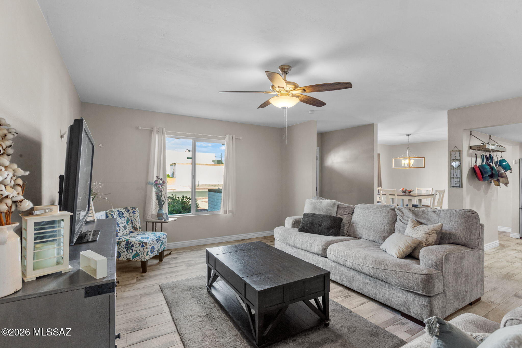Gorgeous single-level townhome with mountain views in established Terra Del Sol! This 2-bedroom, 2-bath home offers ceramic tile throughout, updated cabinetry, newer stainless steel appliances, quartz countertops, and abundant natural light. Remodeled bathrooms feature decorative tile surrounds, updated vanities, and modern fixtures for a fresh, contemporary feel. Enjoy a spacious private patio perfect for outdoor living, plus a detached 2-car garage with built-in storage and additional storage space. Community pool, maintained common areas, and convenient access to shopping, dining, parks, and commuter routes.Assumable 4.5% loan available!