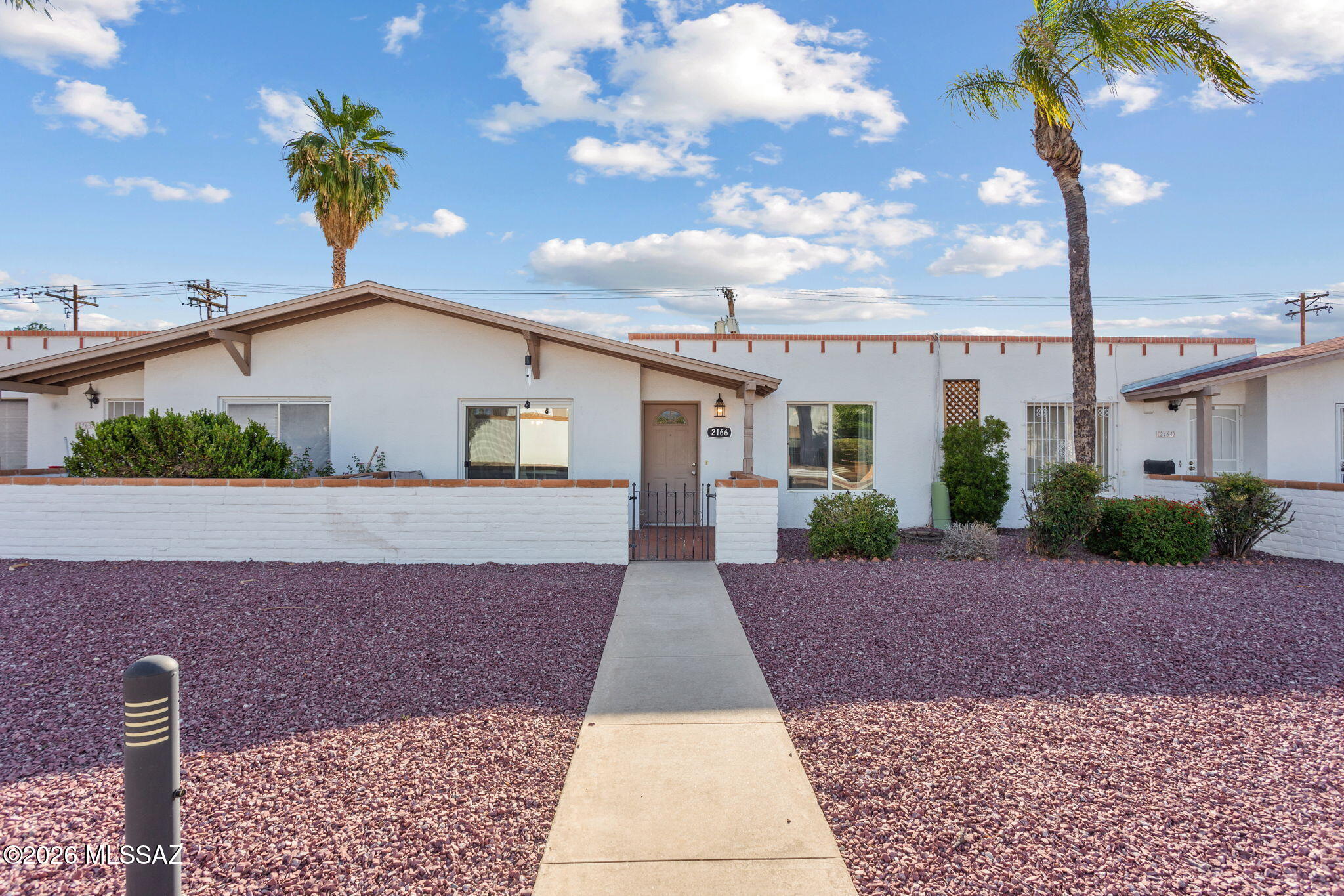 Gorgeous single-level townhome with mountain views in established Terra Del Sol! This 2-bedroom, 2-bath home offers ceramic tile throughout, updated cabinetry, newer stainless steel appliances, quartz countertops, and abundant natural light. Remodeled bathrooms feature decorative tile surrounds, updated vanities, and modern fixtures for a fresh, contemporary feel. Enjoy a spacious private patio perfect for outdoor living, plus a detached 2-car garage with built-in storage and additional storage space. Community pool, maintained common areas, and convenient access to shopping, dining, parks, and commuter routes.Assumable 4.5% loan available!