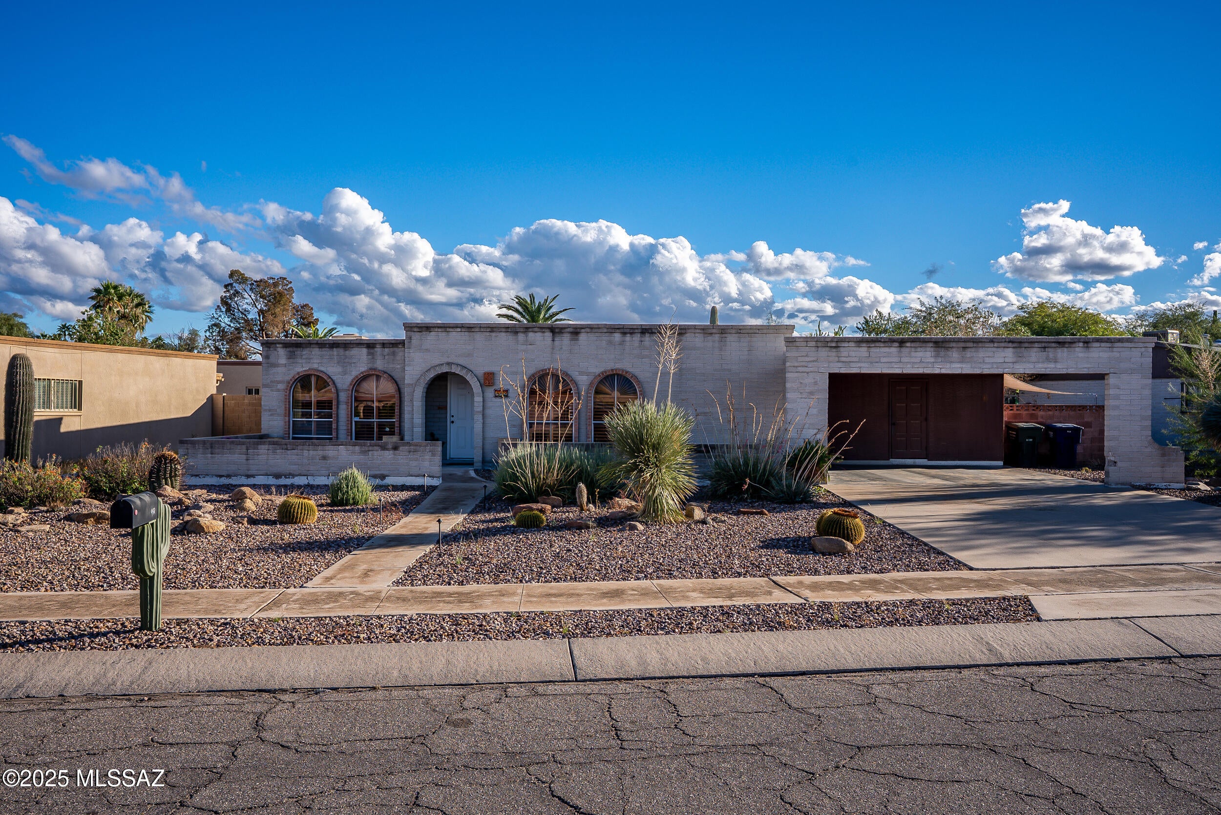 Seller will accept or counter offers between $299,900 and $315,000. Discover this inviting 3-bedroom, 2-bath brick home nestled in a friendly eastside Tucson neighborhood. The living room features a charming fireplace and elegant wooden window shutters that add warmth and character to the space. Enjoy the sparkling pool and take in the beautiful mountain views Tucson has to offer. Conveniently located near shopping, dining, and entertainment, this home offers the perfect mix of comfort, style, and accessibility.
