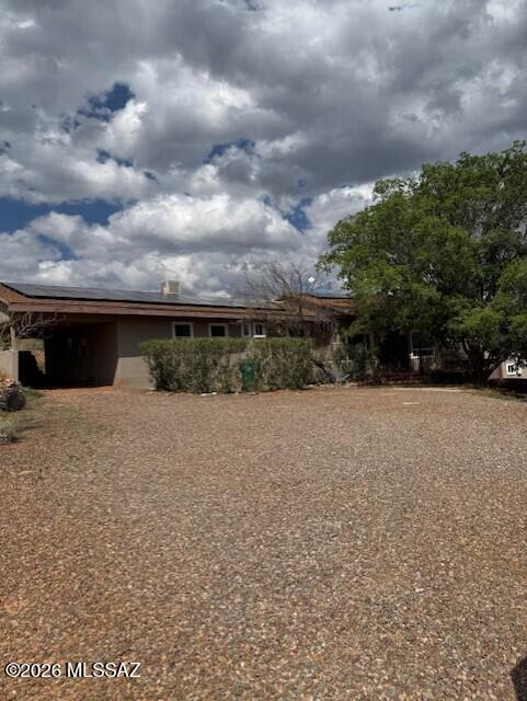 Nice upgraded home with Mountain views.  This home has two wings, one side is the master side the other is the guest side, with a guest suite with its own deck.  One the guest side there are two other bedrooms and a den.  Home features wood beams, upgraded flooring, weed doors, updated kitchen and master suite.  This home also has paid off solar for virtually no electric bills.  Home has a central family room with pot belly stove.  This home is priced to sell with 1.25 acres and a 2 car attached garage,