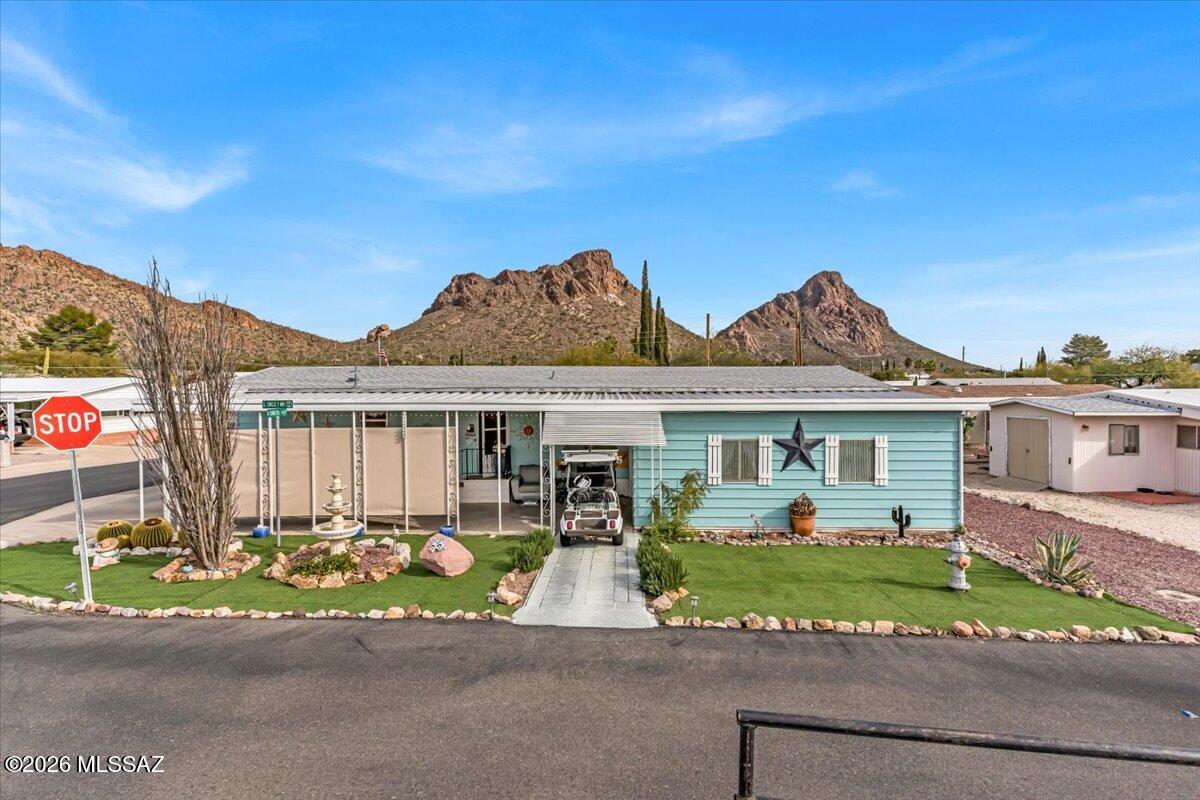 Golf, mountain views & resort-style living! Welcome to this unique 4-bedroom home in an active 55+ community where every day feels like a getaway. The open-concept kitchen, dining and living area is perfect for entertaining, with an updated kitchen offering generous counter space. Relax in the Arizona room while enjoying beautiful mountain views, or unwind on the private patio. An attached garage adds convenience, and the approximately 2-year-old A/C provides year-round comfort. HOA includes golf, 2 pools, spa, pickleball, tennis, fitness center, community center, clubs, activities & more! Enjoy an active lifestyle with plenty of opportunities to socialize, stay fit and meet new friends.