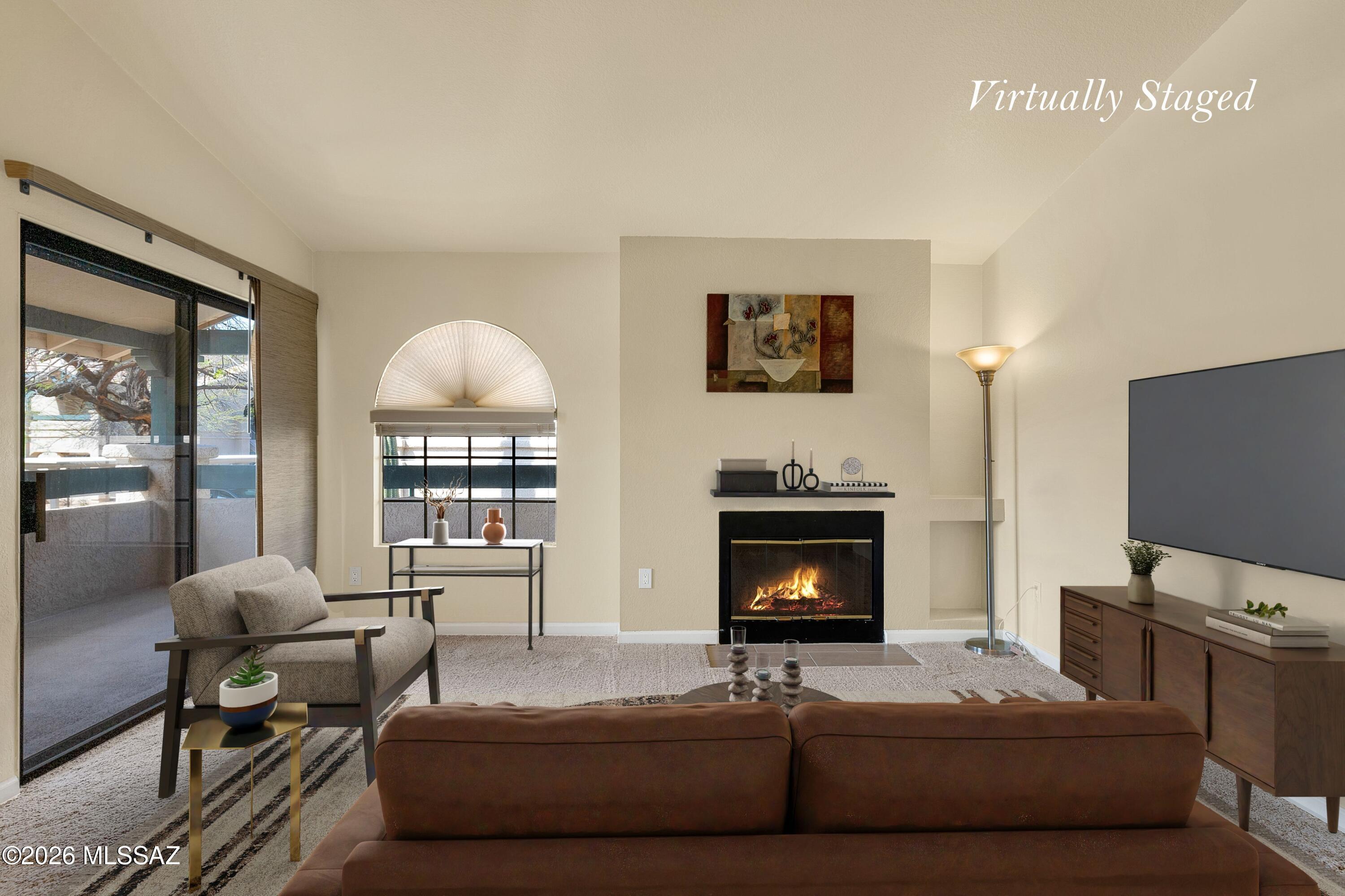 Seller Financing may be available. Experience effortless resort-style living in this beautifully updated 2-bedroom, 2-bath condominium at Moonrise at Starr Pass. This upper-level unit offers higher ceilings and additional safety from the 2nd-floor balcony. Perfectly positioned adjacent to the renowned Starr Pass Golf Club and surrounded by scenic walking and hiking trails, this community offers an exceptional lifestyle with amenities including a pool and spa, tennis courts, fitness center, and clubhouse. Unit 7201 is truly turnkey, with an extensive list of thoughtful upgrades that elevate both comfort and functionality. The interior features updated flooring, fresh paint, new carpet, and a fully refreshed kitchen with newer appliances and undercabinet lighting.... (Continued) Both bathrooms have been tastefully enhanced with new vanities, mirrors, fixtures, toilets, and resurfaced shower and tub. Major systems have also been addressed, including a 3-year-old HVAC system, a newer water heater with a pressure tank, and updated plumbing with new valves and a dedicated main water shutoff to the unit. Additional improvements include replaced electrical receptacles and switches, newer window coverings, and resurfaced patio floors. The spacious great room seamlessly integrates living and dining areas, anchored by a cozy fireplace--ideal for both relaxing and entertaining. A dedicated covered parking space adds convenience, while the surrounding natural desert landscape and resort amenities create a lock-and-leave opportunity or full-time residence with minimal maintenance. A rare opportunity to own a meticulously upgraded condo in one of Tucson's premier resort communities.