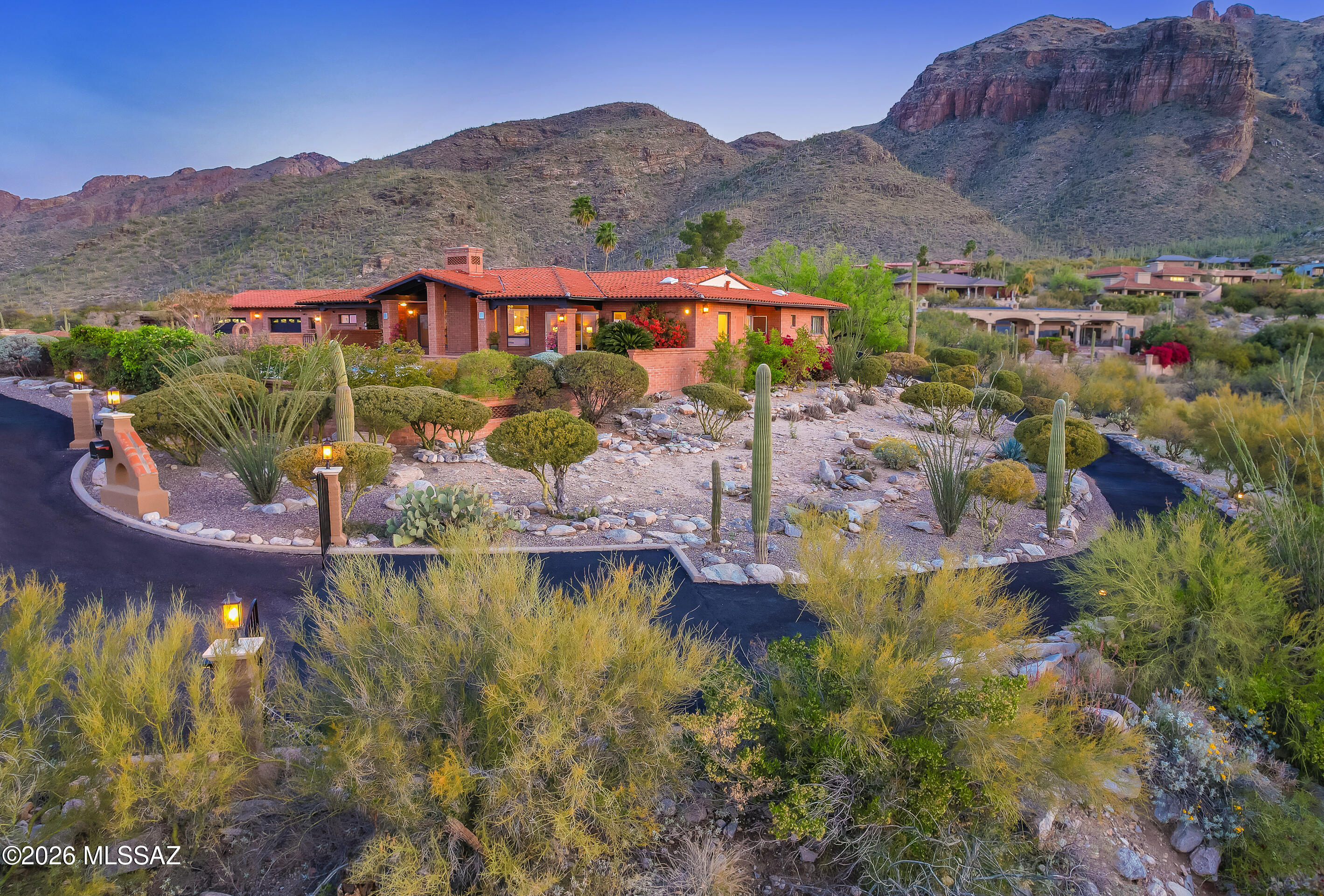Every 10 or 20 years, an iconic home becomes available in Tucson, one that embodies all the beauty, charm and BREATHTAKING VIEWS that make the Tucson Foothills, one of the most enviable  home destinations in the world. This home is the essence of that, a very RARE and COVETED find. With RARE 360.0 ! SPECTACULAR VIEWS, from literally every window of the home, on a private, near 2 acre estate lot, high up, in the prestigious, GATED Cobblestone.. Mansion Magazine is quoted as saying, ' Today's luxury home buyers are looking for an experience. They're looking for a feel'. This rare offering is, the essence of the Best of the Best in Tucson, 'experience and feel',  VIEWS & TIMELESS CHARM. Only available for a short time, don't miss your opportunity for a true iconic beauty.  LUXURY AMENITIES LUXURY AMENITIES PLUS -  a spacious backyard complete w/ putting green, a 20 x 40 pool, heated, jetted spa, a 6 car garage w/ room for RV , 17 foot wd beamed ceilings, solid wood floors, View windows - in every room to AMAZING SUNSETS AND SUNRISES, NEW home roof Oct - 2025, NEW lighting, paint flooring, window coverings, 2026, contemporary, charming  kitchen and baths - AND... A putting green, Viking appliances, all gas cooking and heat, solid wood floors, 17 foot wood beamed ceilings, open floor plan,  heated, jetted spa, HUGE, near flat outdoor space, Covered Outdoor Dining Patio, water filtration system, two gated entries, in a the OG, luxury gated community. top of hill, end of cul de sac, pick up at door- trash service - included in HOA low fee, many Fruit trees, Beautiful Landscaping !