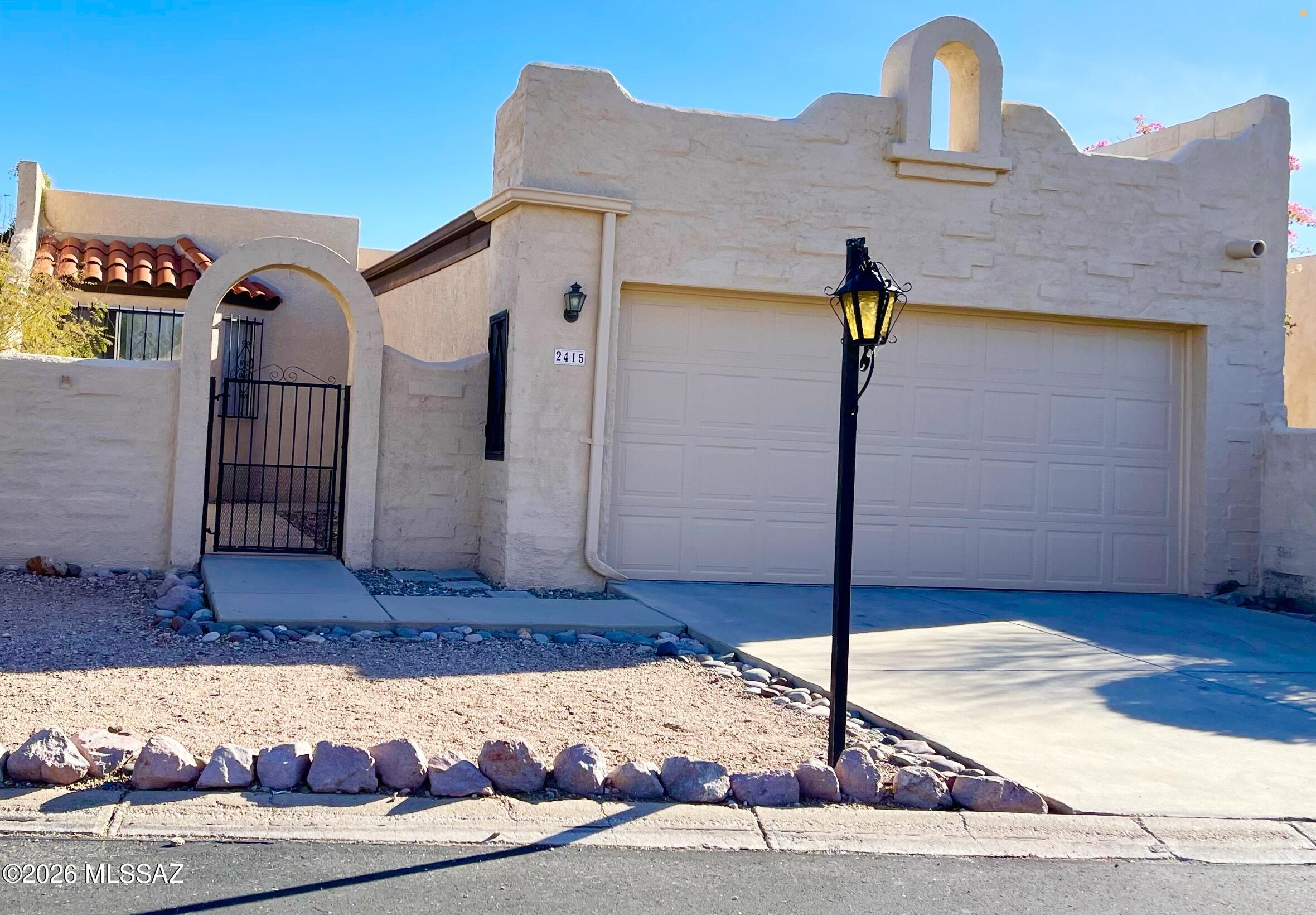 Discover this delightful Spanish Mission-style 2-bedroom, 2-bath townhome in a small community of just 106 homes. Located minutes away from the Modern Streetcar, Downtown, UA, and Pima Community College, this 1,234 sq ft home features a bonus den, a cute kitchen, and bay window. Updated flooring. The living room's sliding glass door opens to a lovely patio and a spacious walled backyard. The two-car garage also has a good-sized storage area attached. Pool/spa and nearby walking/biking paths.